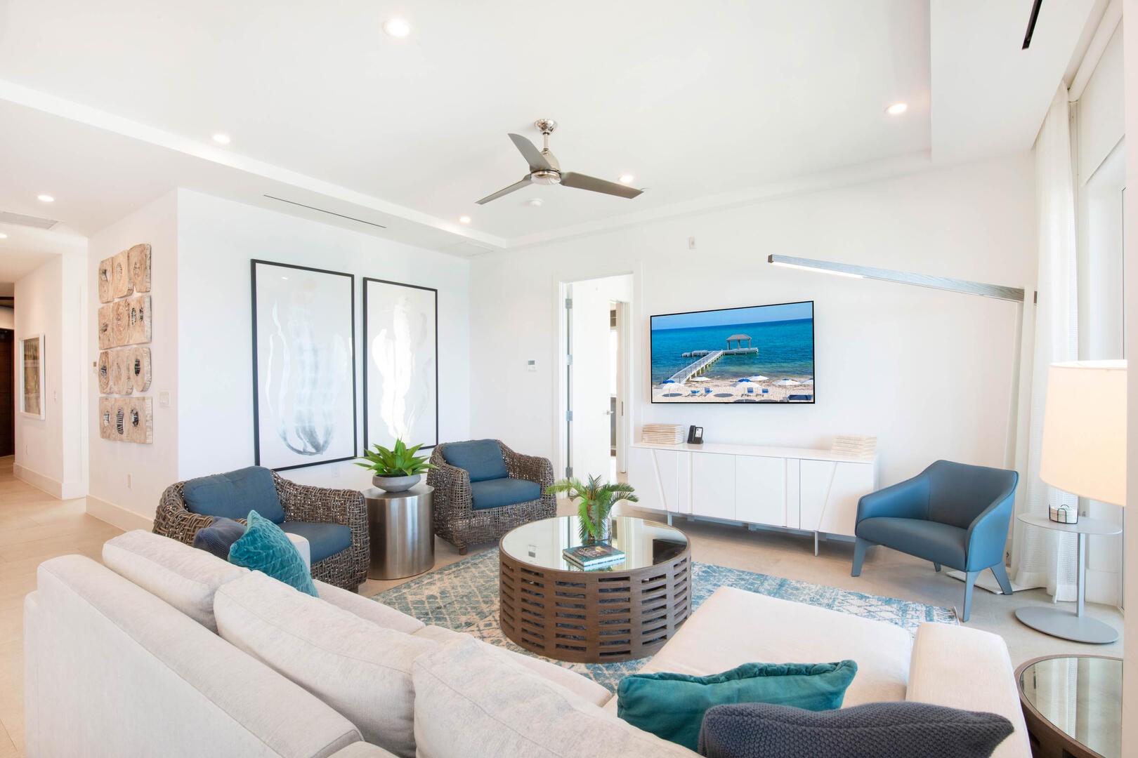 Living area with sectional sofa and SmartTV.