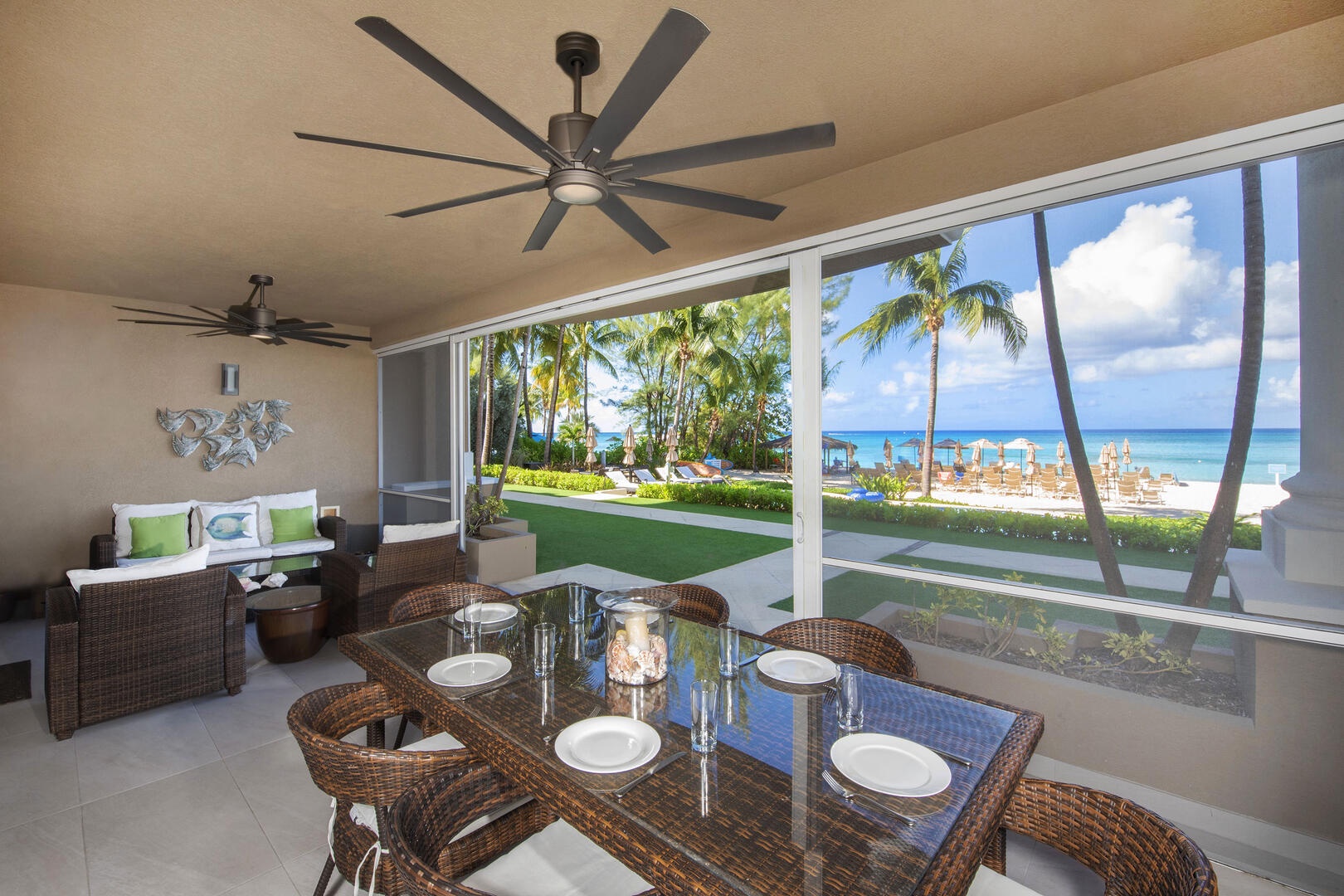 Furnished screened patio with beachfront views.