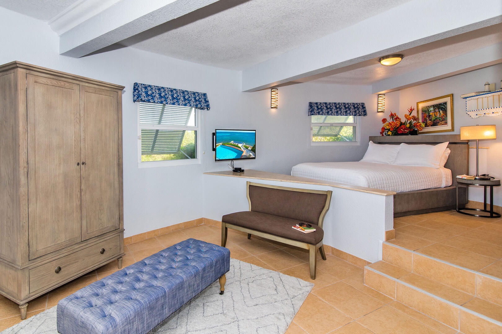 The queen suite sits off the pool deck with private entry from the rest of the villa.