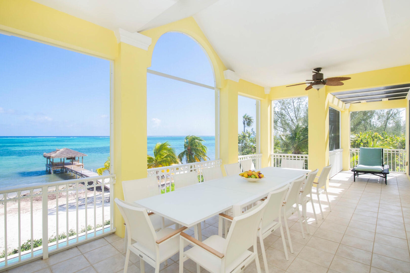 Balcony dining table with oceanfront views.