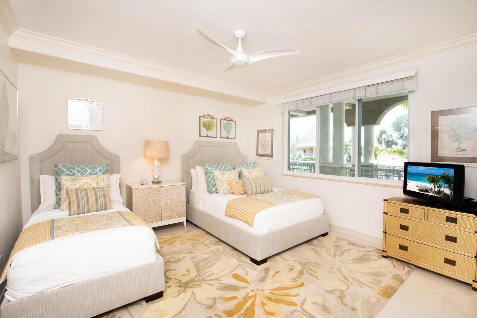 Bedroom 4 furnished with a queen bed, twin bed, and television.