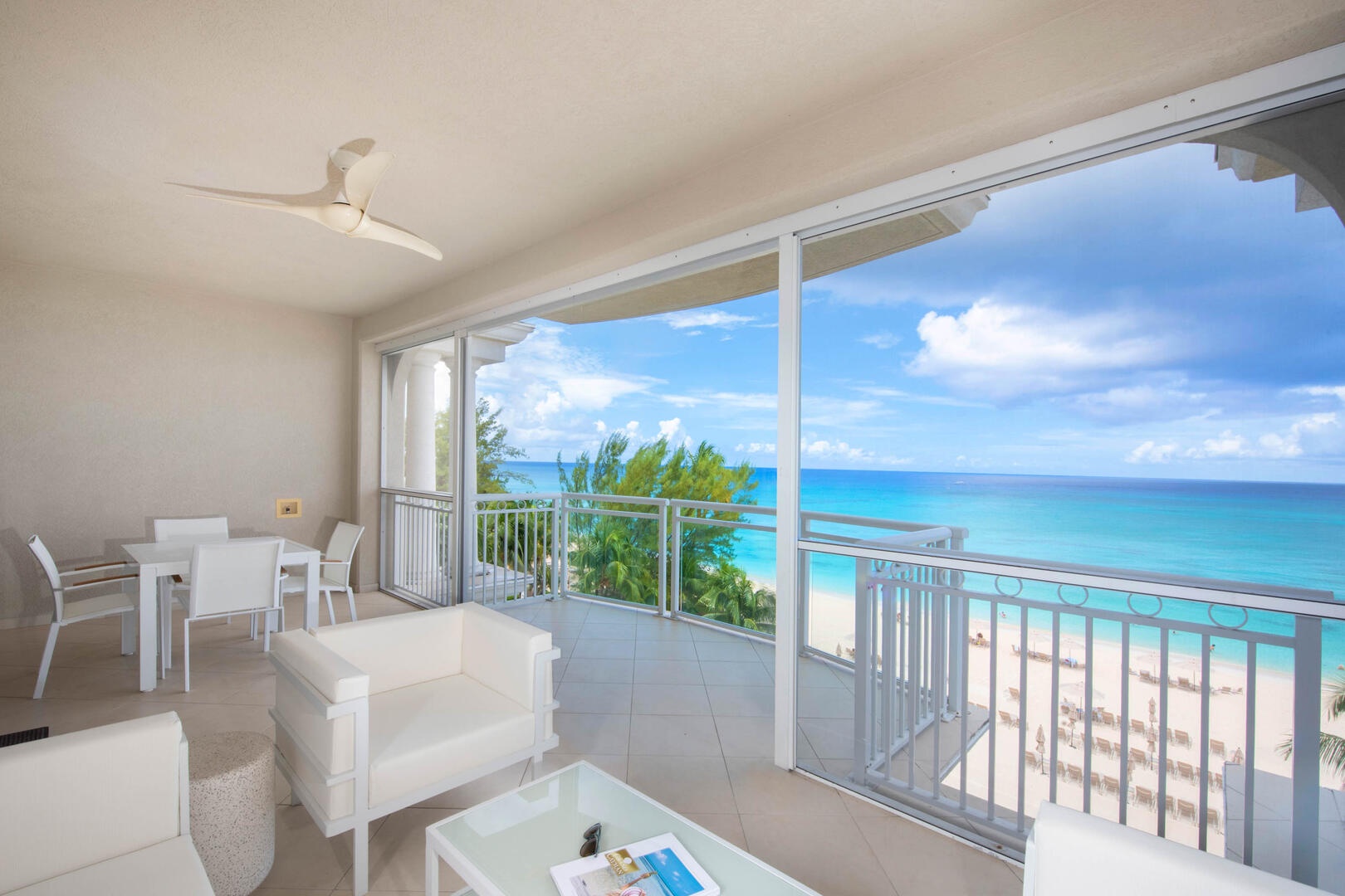 Furnished screened balcony with touch the sky oceanfront views.