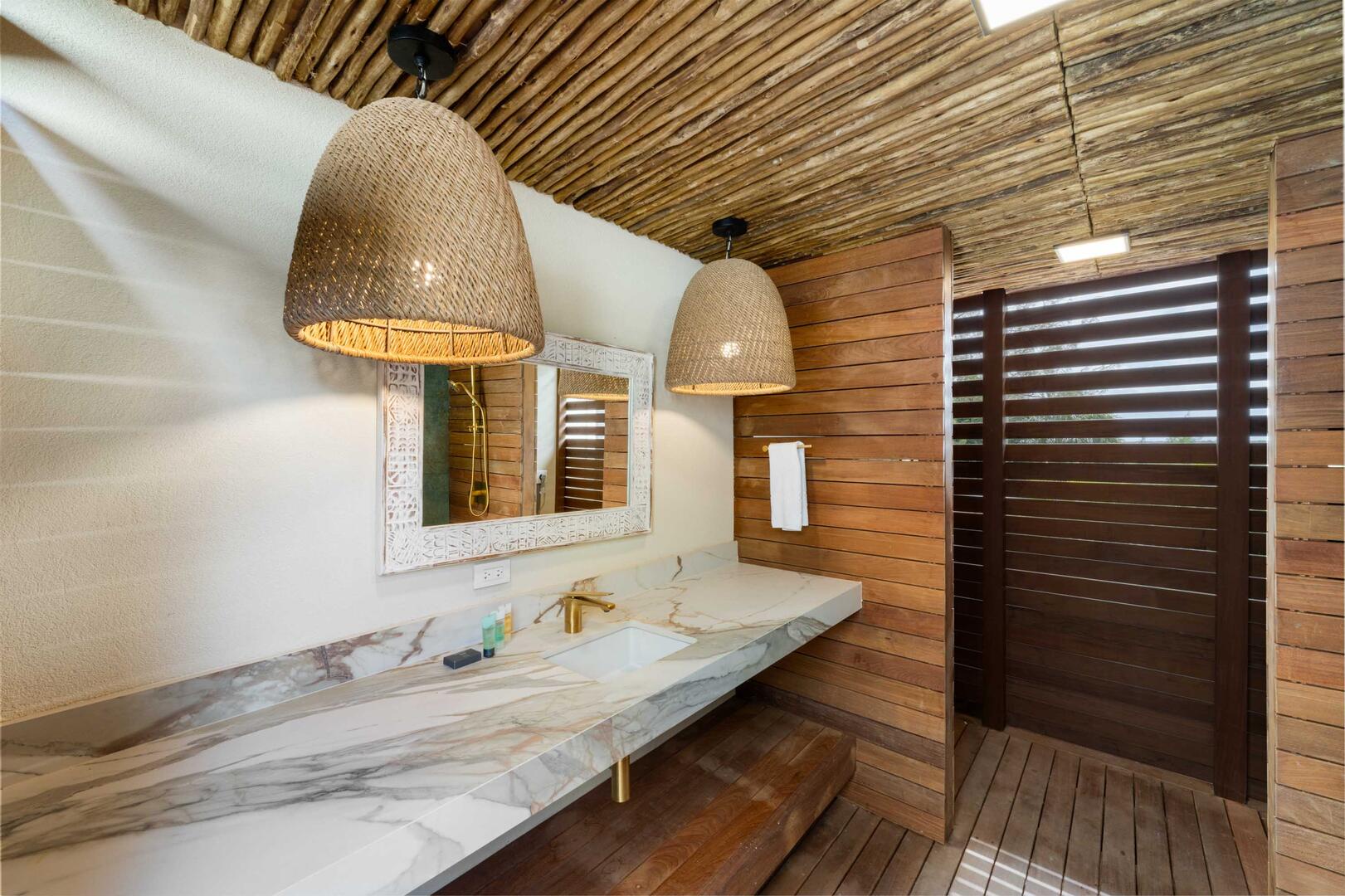 Bedroom 3 uses this detached full bath equipped with a shower.