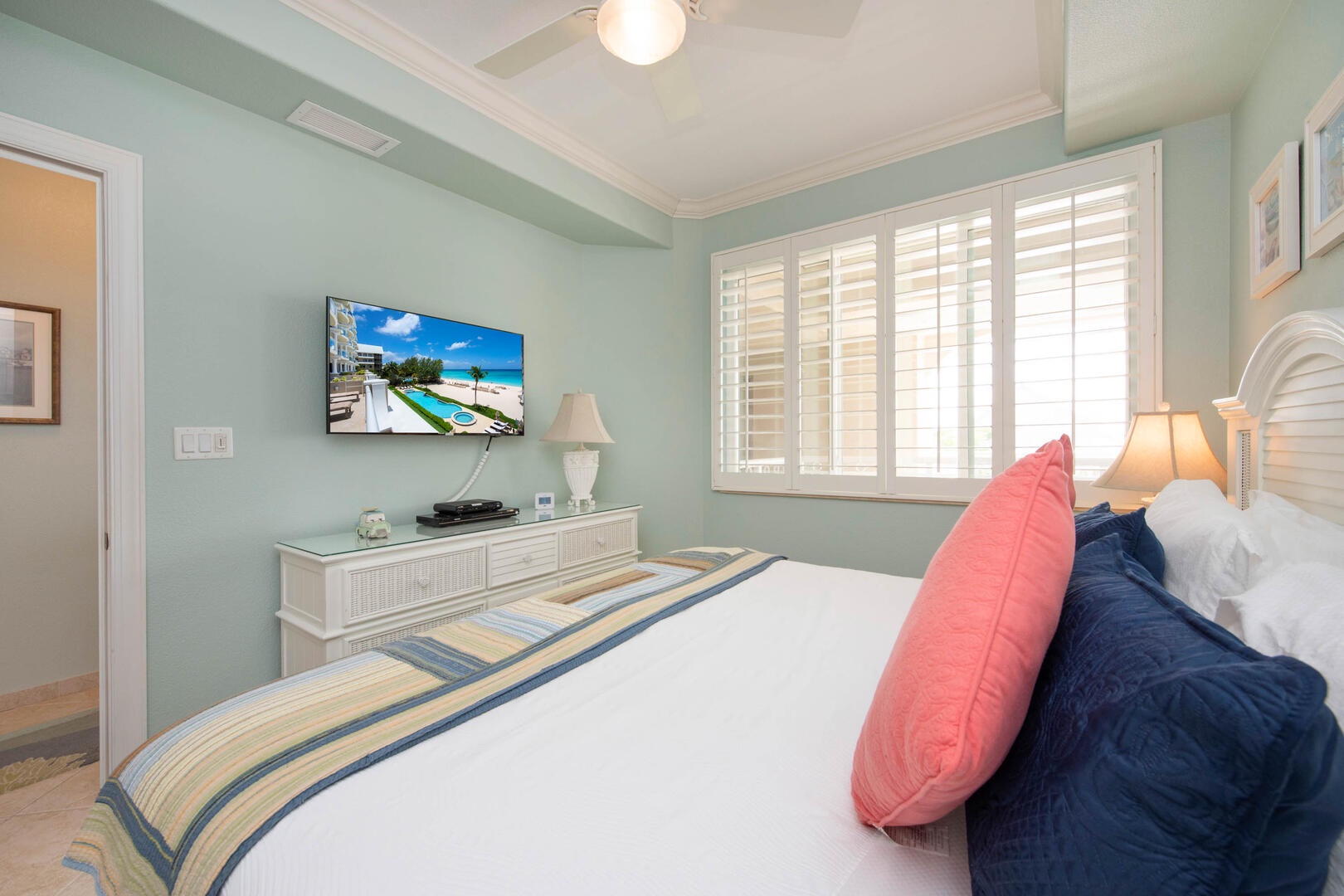 Guest Suite #1 furnished with king bed and television.