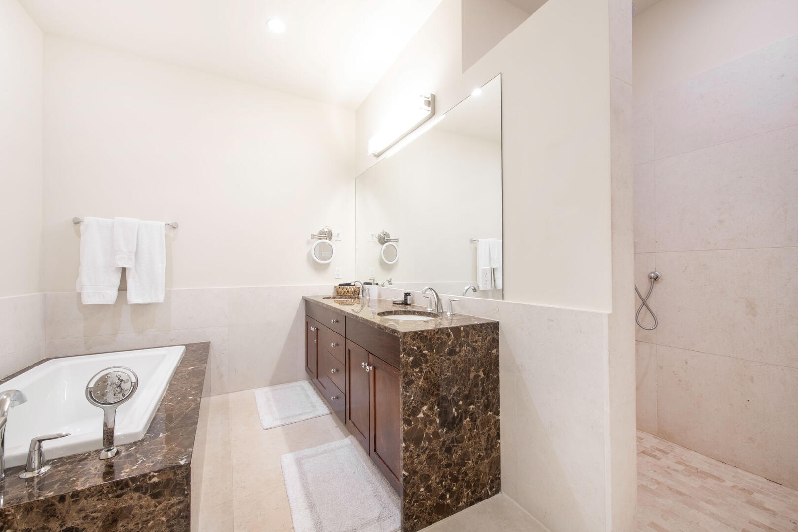 Guest Ensuite #2 with dual vanity, soaking tub, and separate shower.