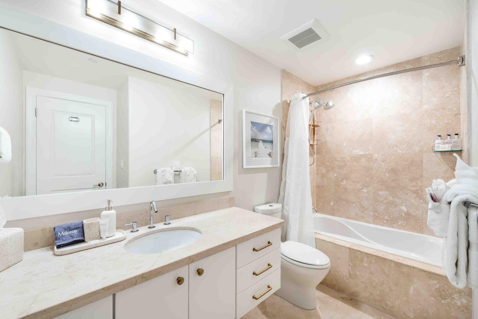 Guest Ensuite #1 with a shower bath. All bath and beach towels are provided complimentary during your stay.