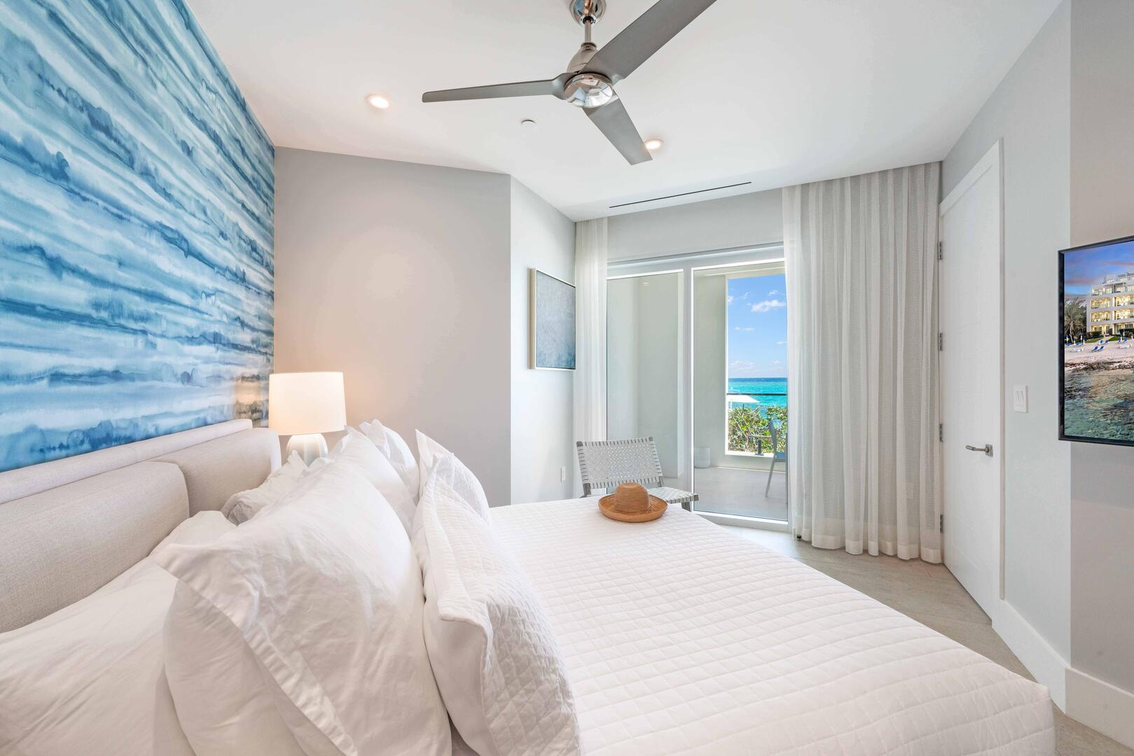 Primary Suite with king bed, television, and walk-out access to the veranda. .