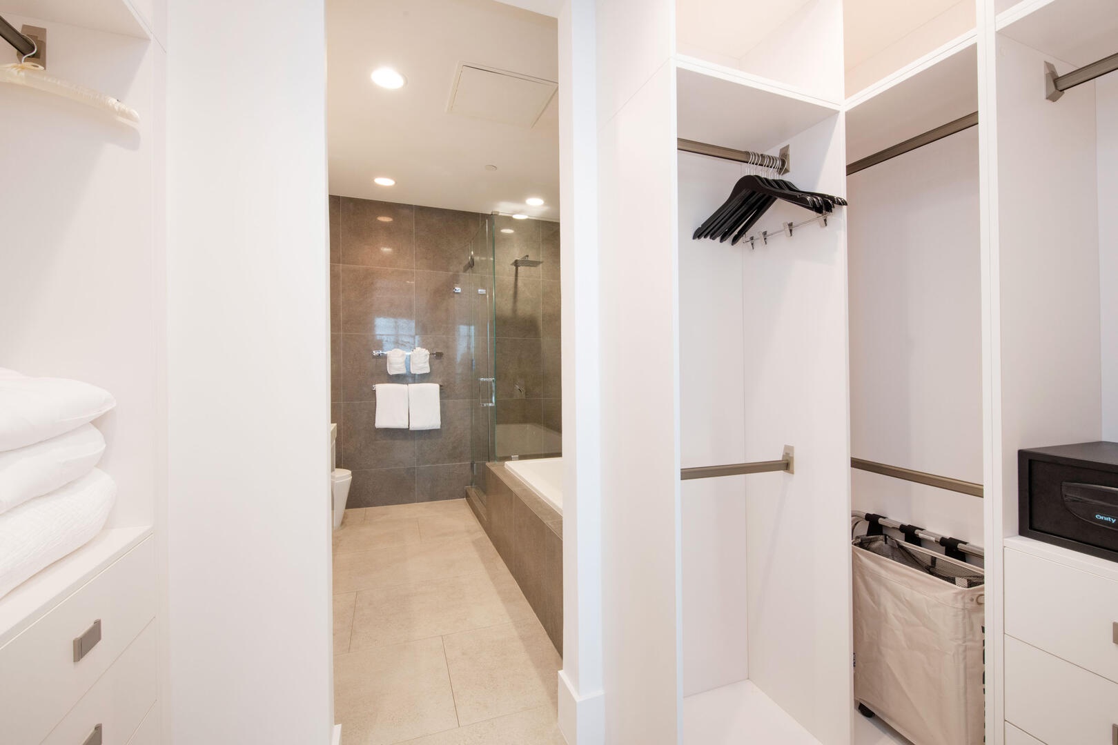 Walk-thru closet with room safe.