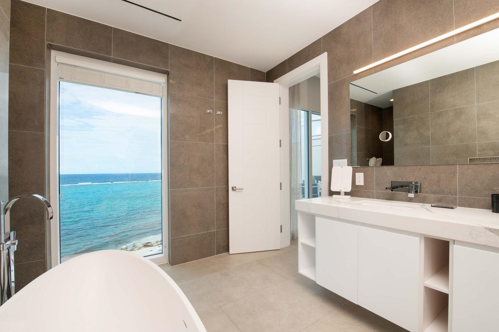 Primary Suite ensuite bath with dual vanity, soaking tub, and walk-in shower.