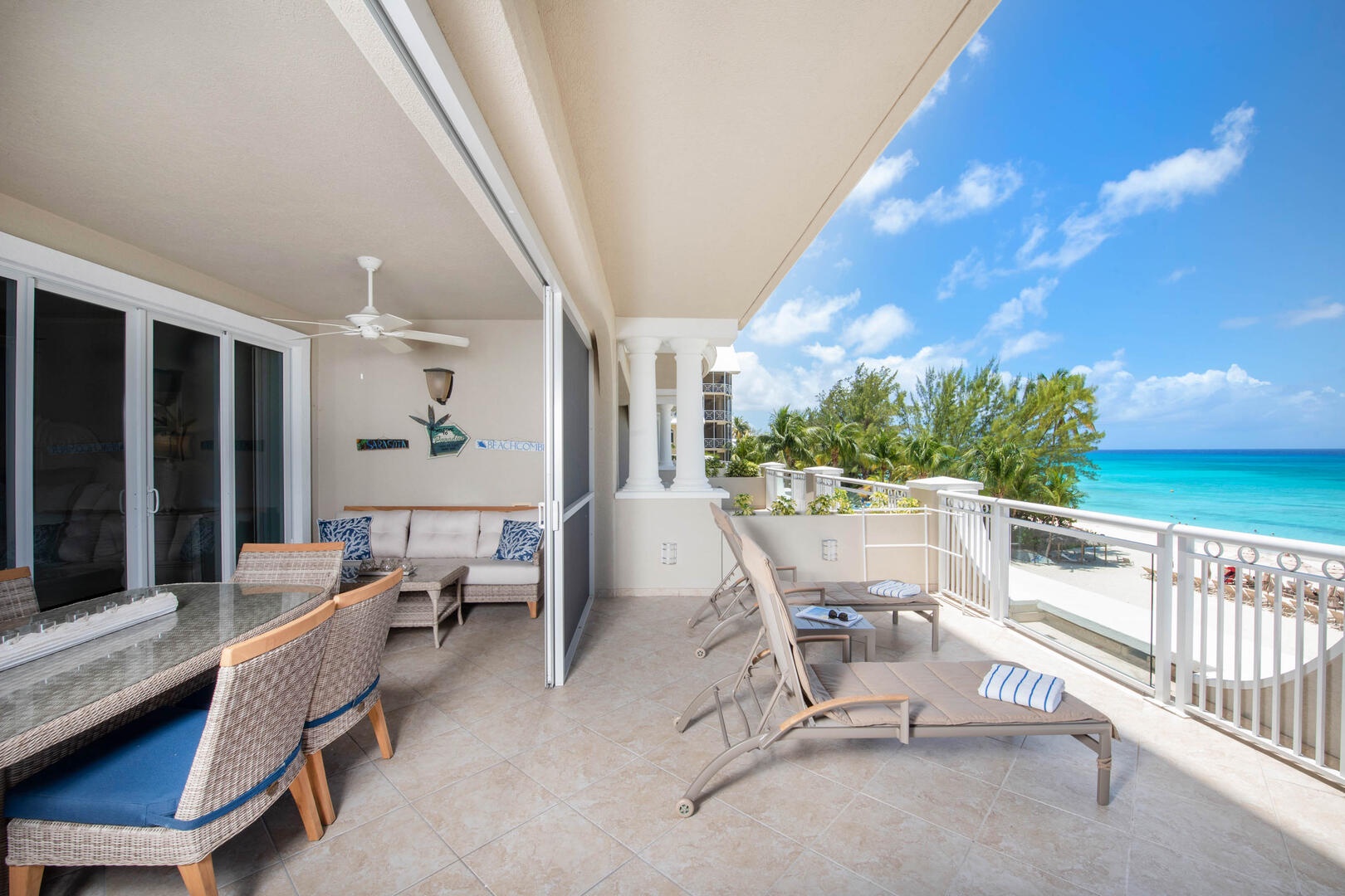 Spacious balcony with outdoor furniture.