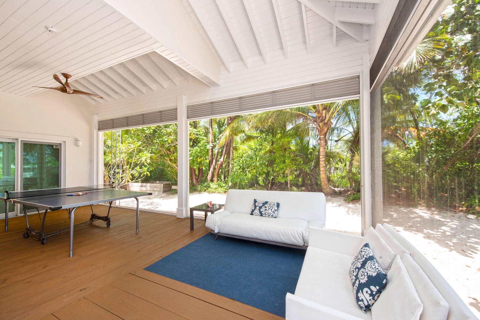 Porch area with ping pong table.