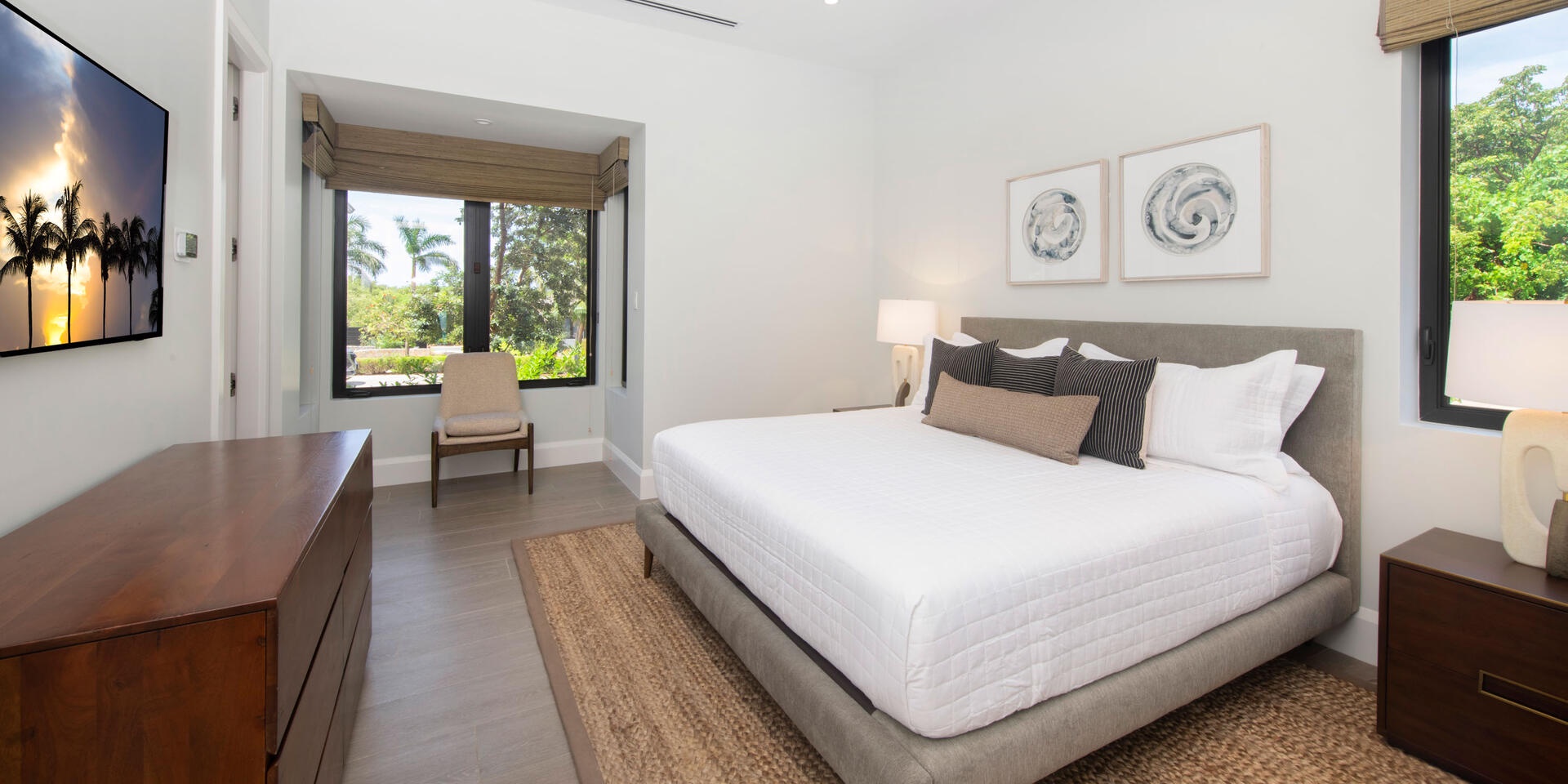 Bedroom 4 is the only land-side bedroom in the main villa. It's furnished with a king bed, and SmartTV.