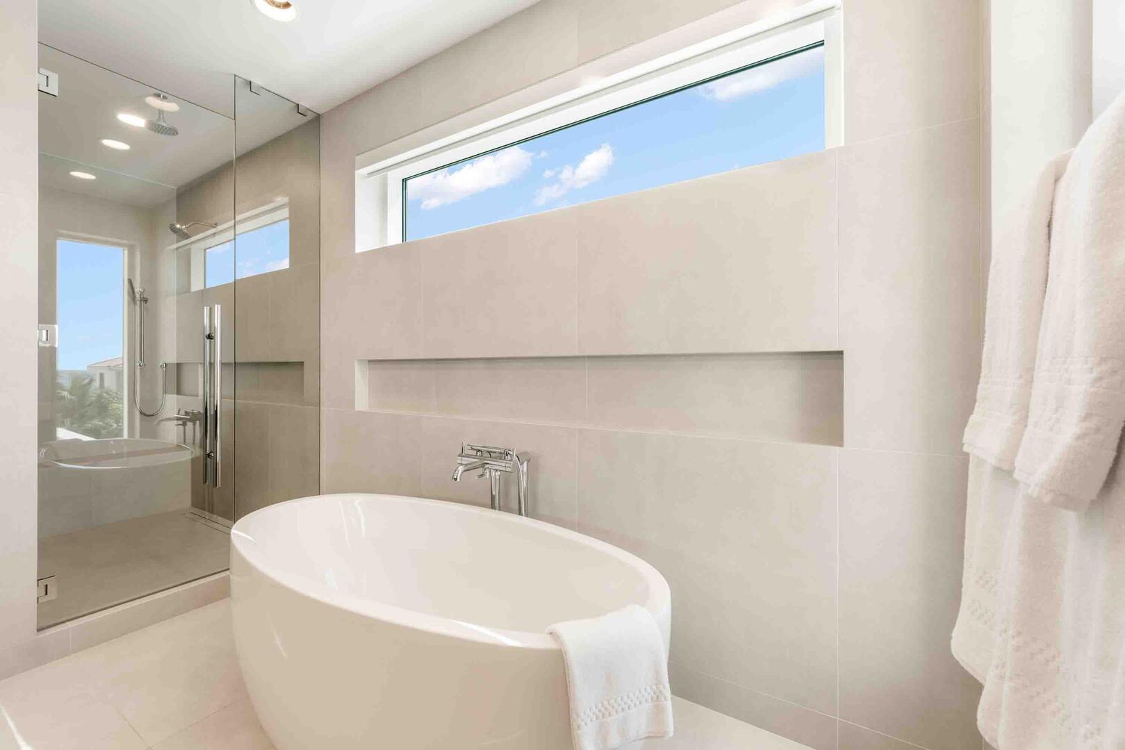 Soaking bathtub and separate shower with rainfall shower head. All bath and beach towels are provided during your stay.