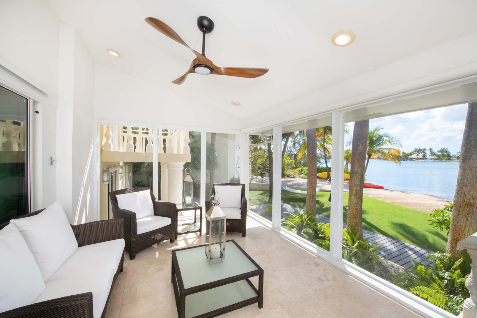 Sitting area with waterfront views along the sun room.
