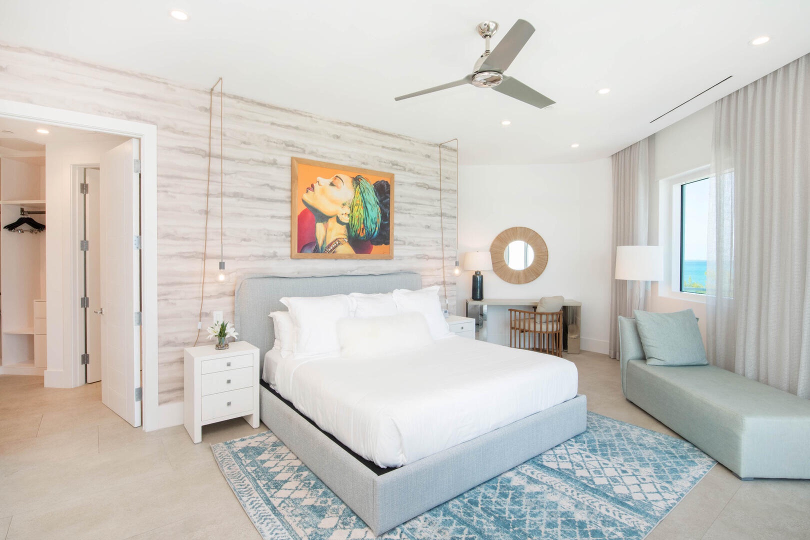 Primary Suite #1 with king bed and desk + chair.