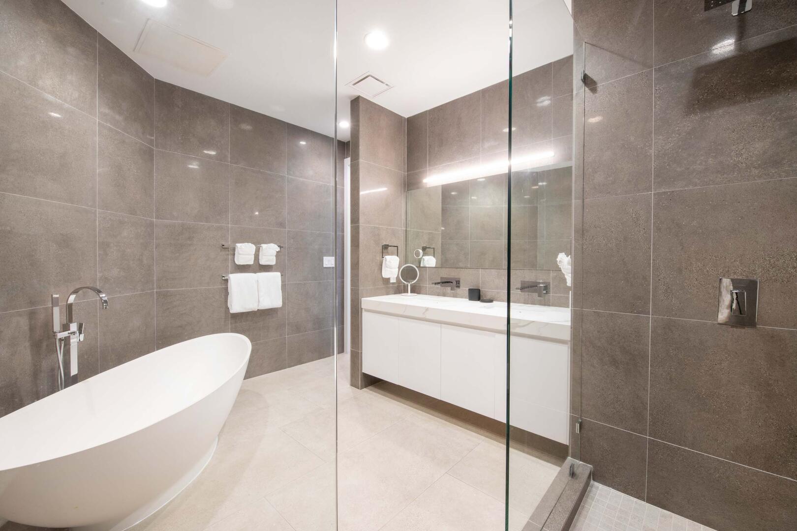 Primary Suite ensuite with dual vanity, soaking tub, and walk-in shower.