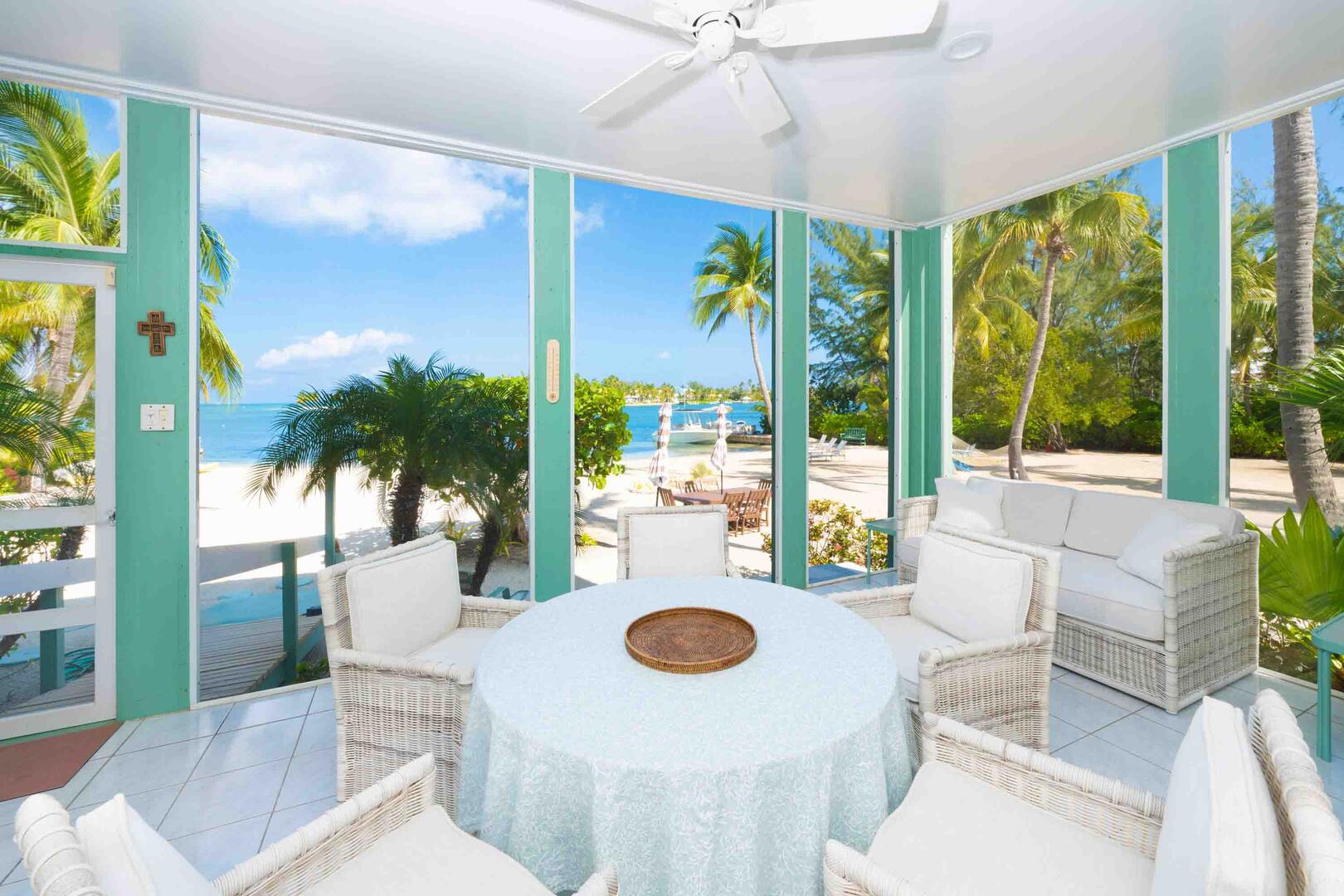 Furnished sunroom with waterfront views.