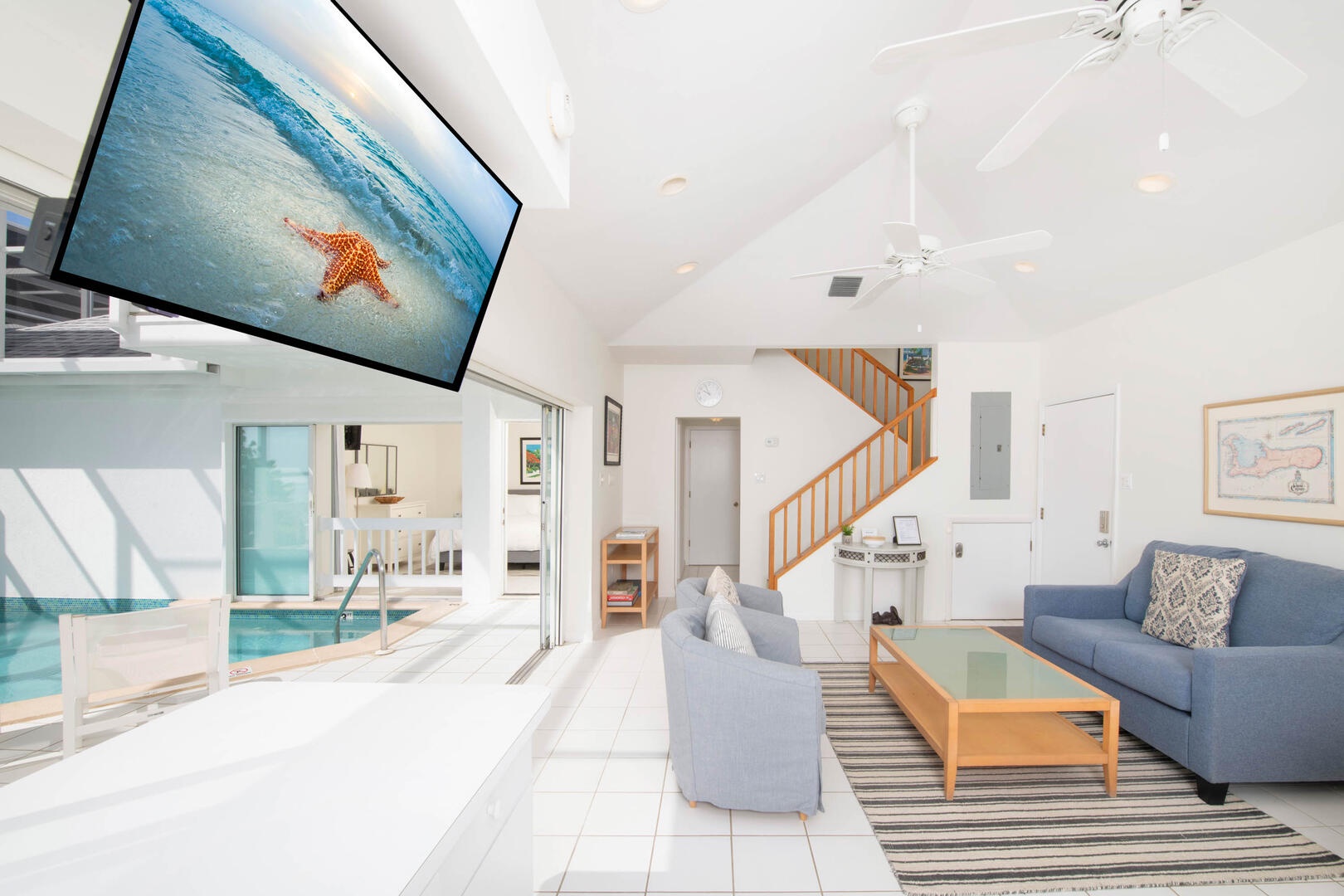 Stairway to the upper level primary suite.