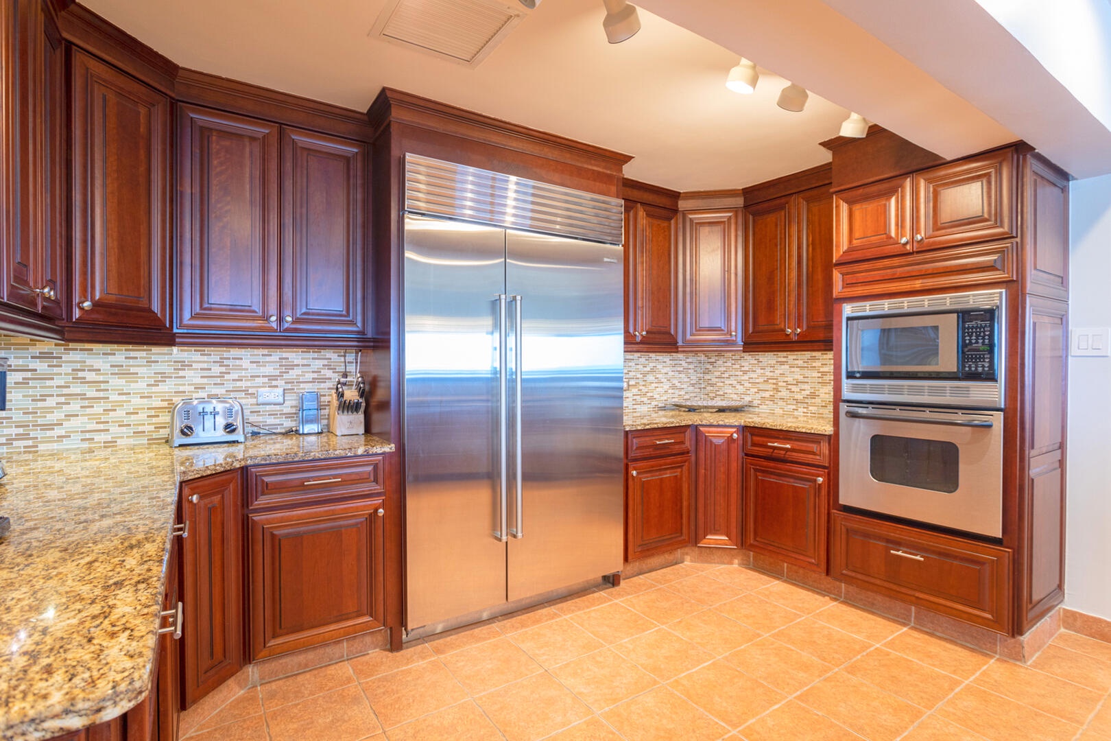 Full kitchen with modern appliances.