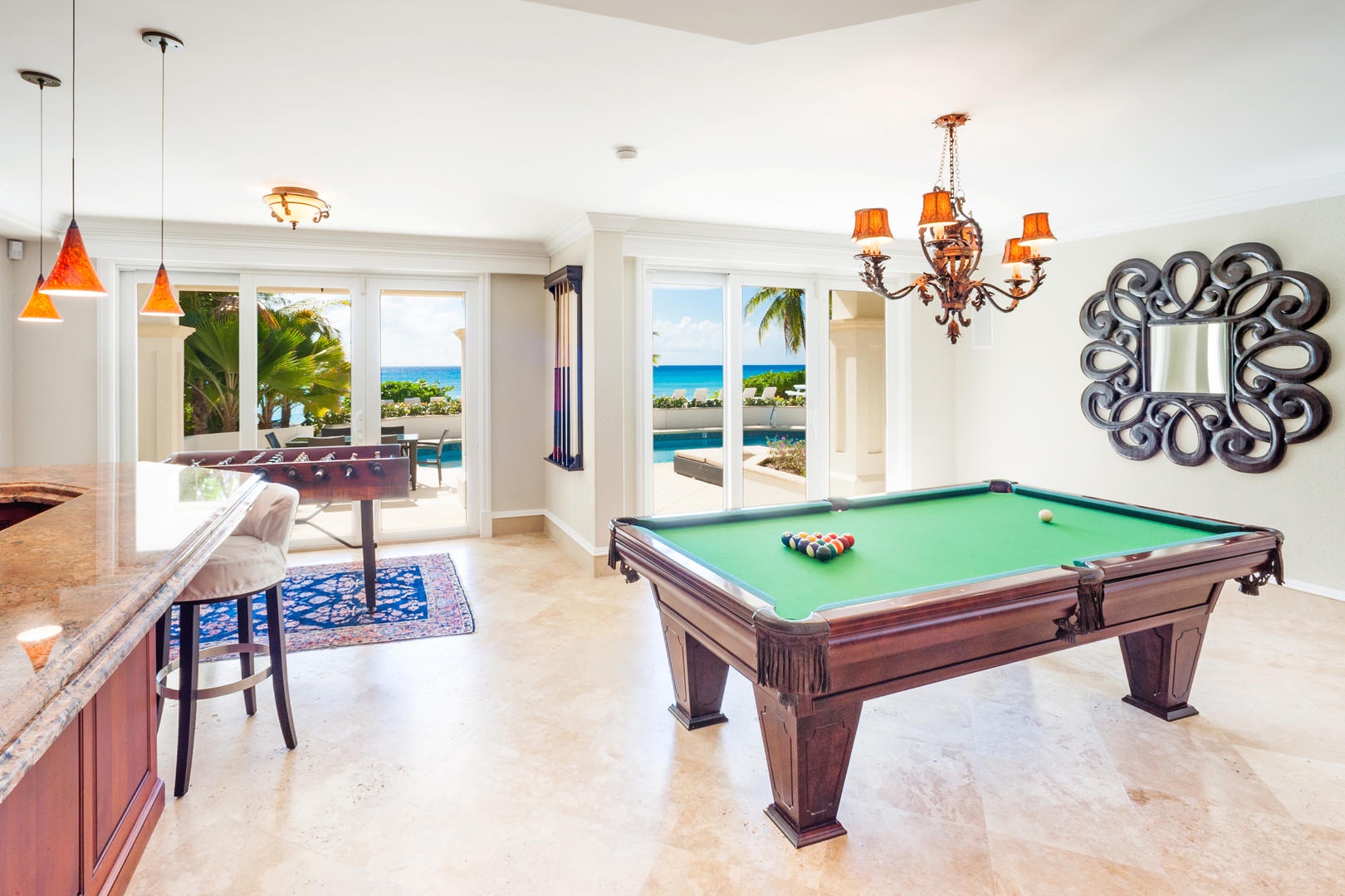 Play a game or foosball or pool by the bar area.