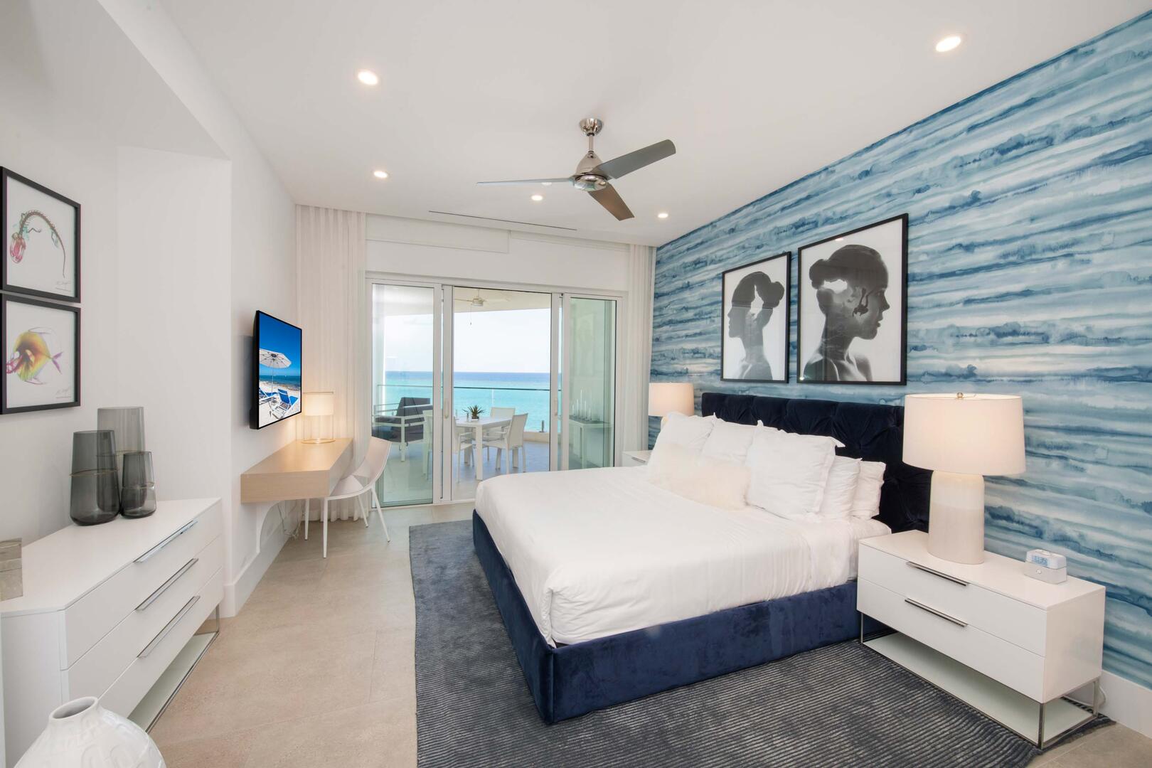 Primary Suite with ocean views, walk-out access to a roofed balcony, SmartTV, walk-in closet