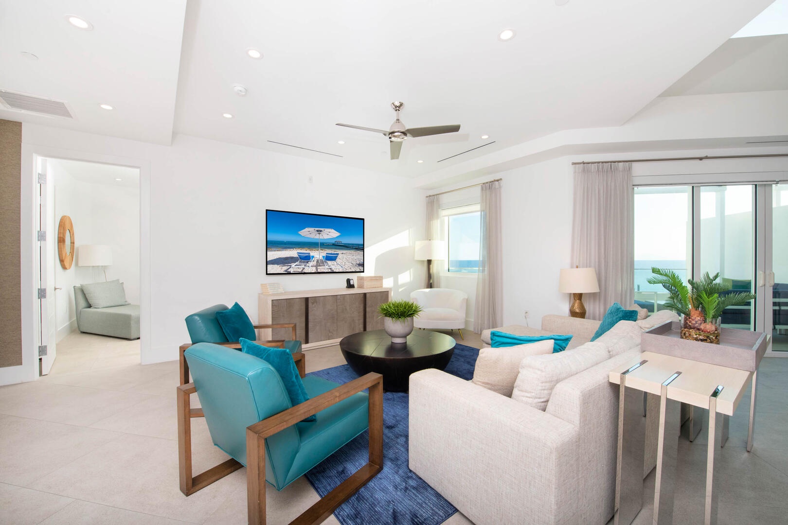 Living area with large windows for natural sunlight.