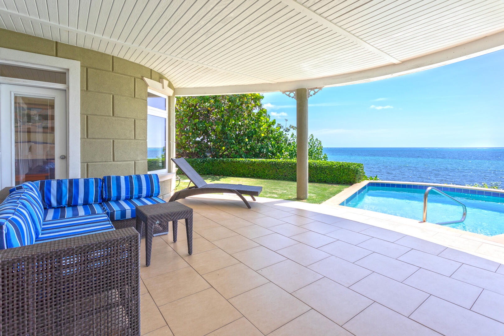 A veranda pool deck provides much need shade poolside.