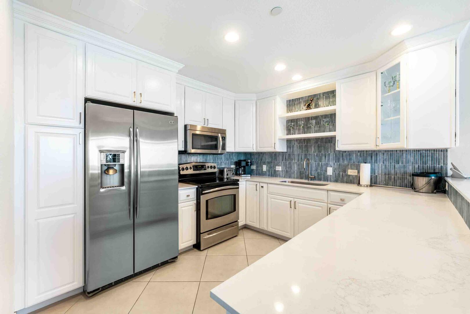 Renovated kitchen with modern appliances and a drip coffee maker.