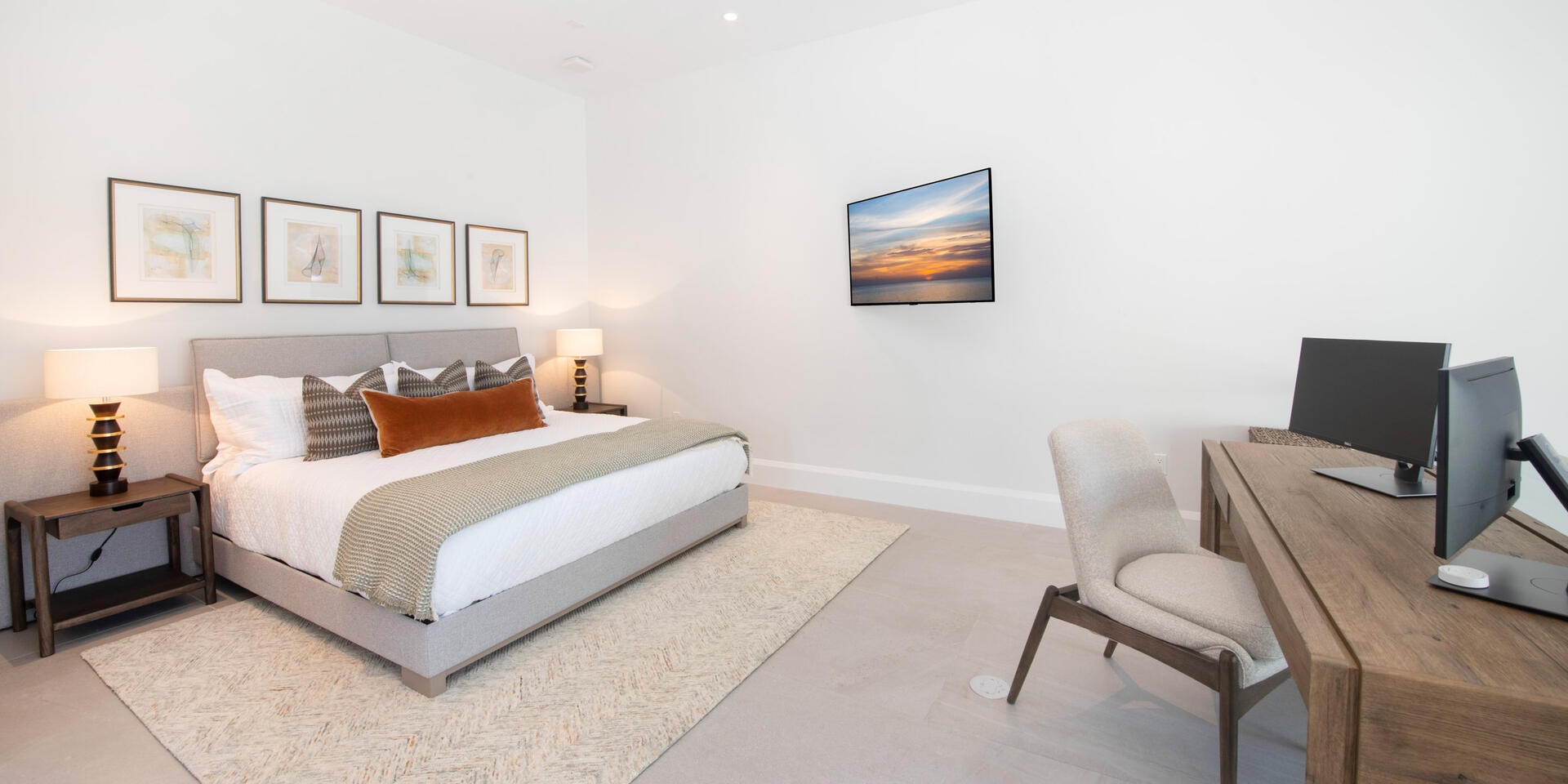 Bedroom 5 is furnished with a king bed, SmartTV, plus a desk + chair with dual monitor hub.