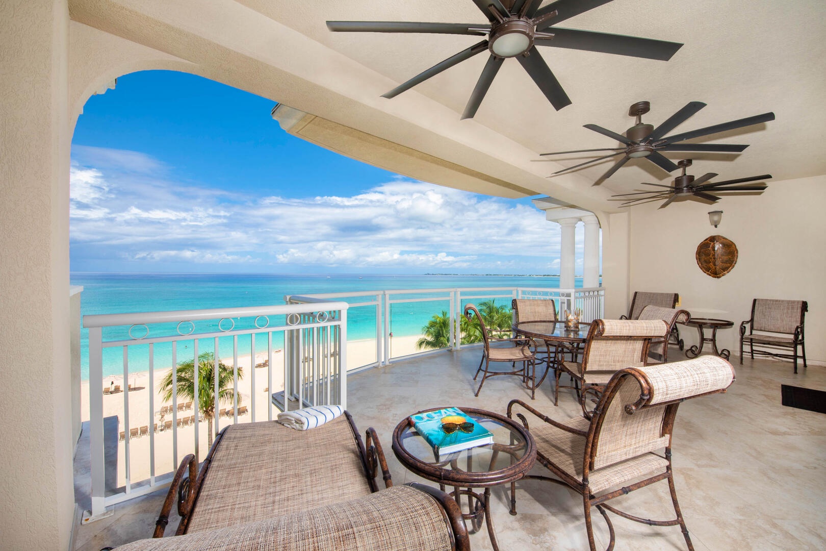 Furnished balcony with touch the sky views of Seven Mile Beach.