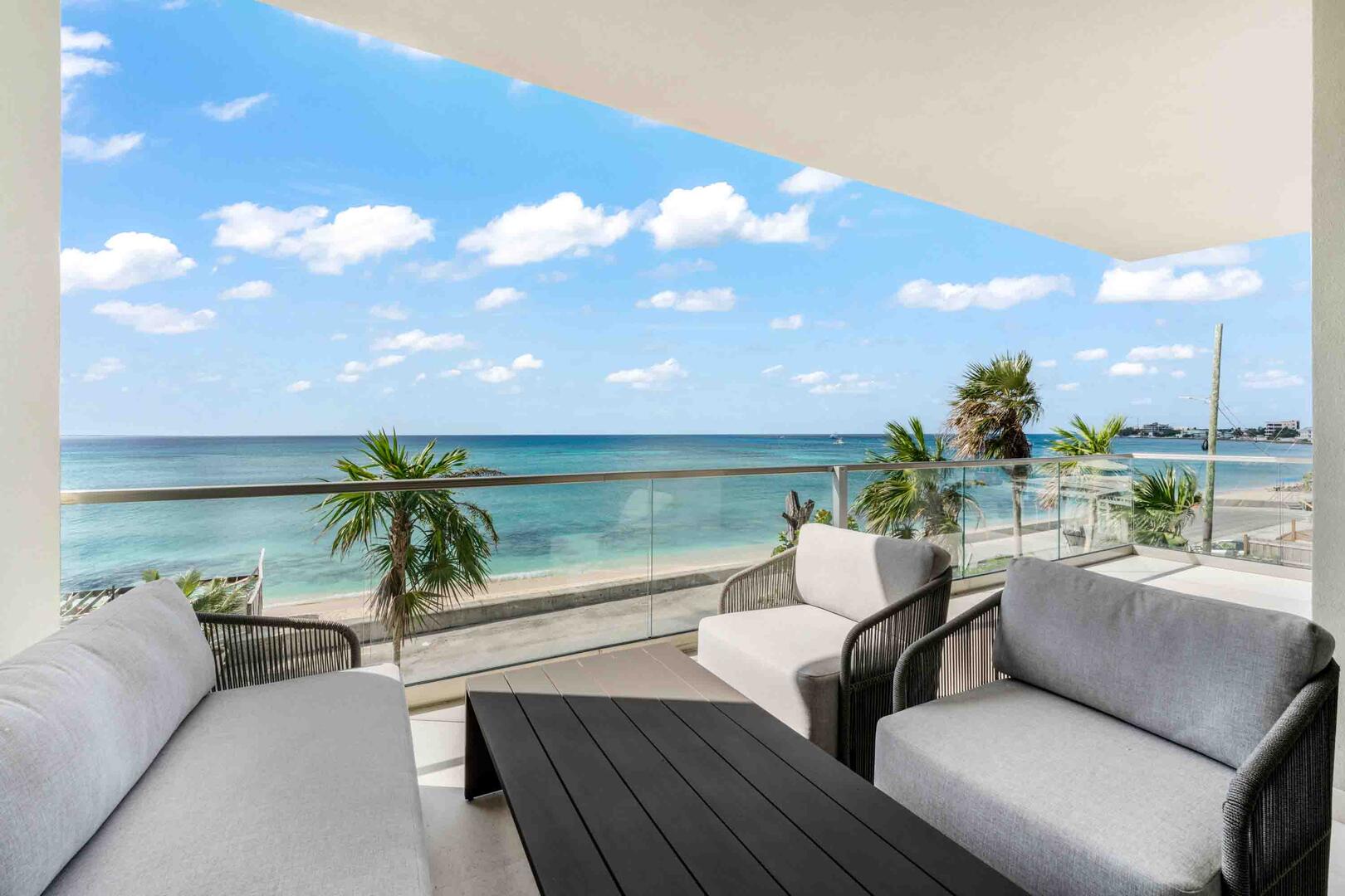 This second floor condo enjoys a private furnished balcony with elevated oceanfront views.