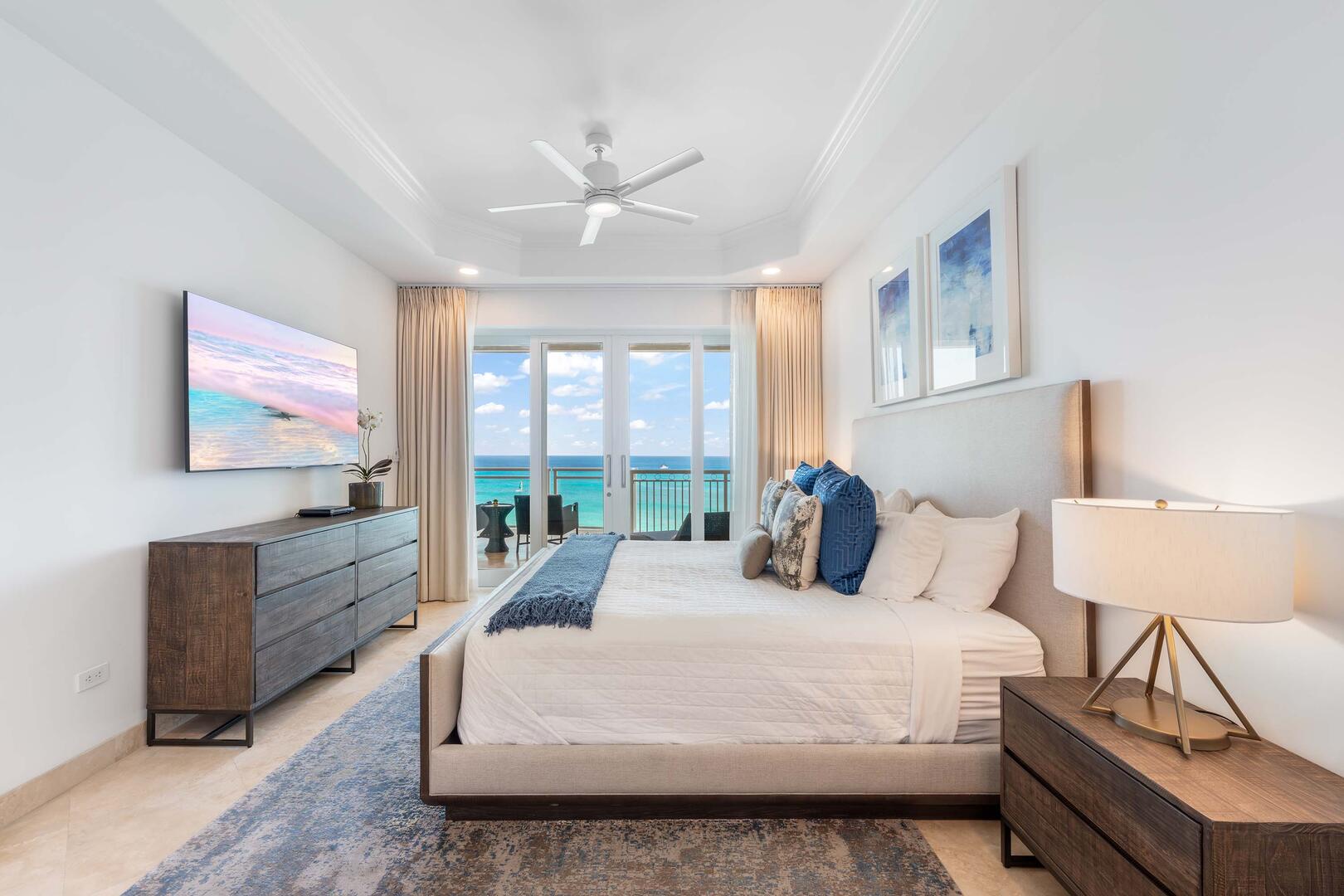 Primary Suite with king bed, HD cable television, and walk-out access to the ocean balcony.