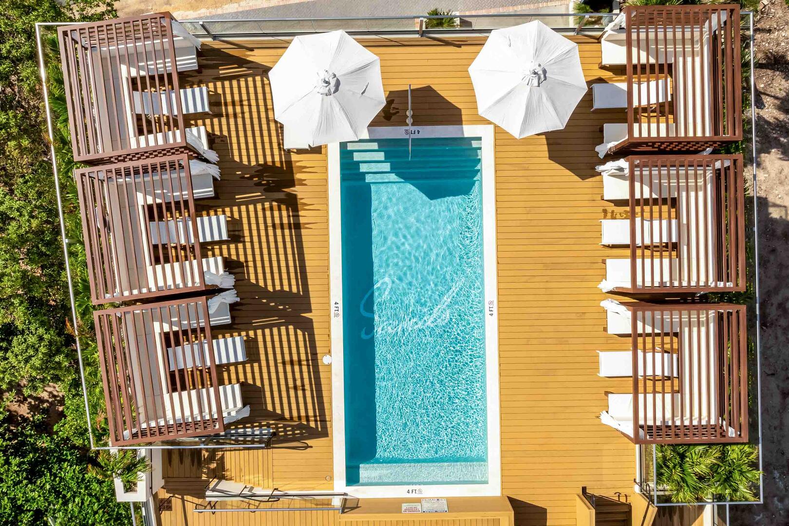 Rooftop pool deck and cabanas.