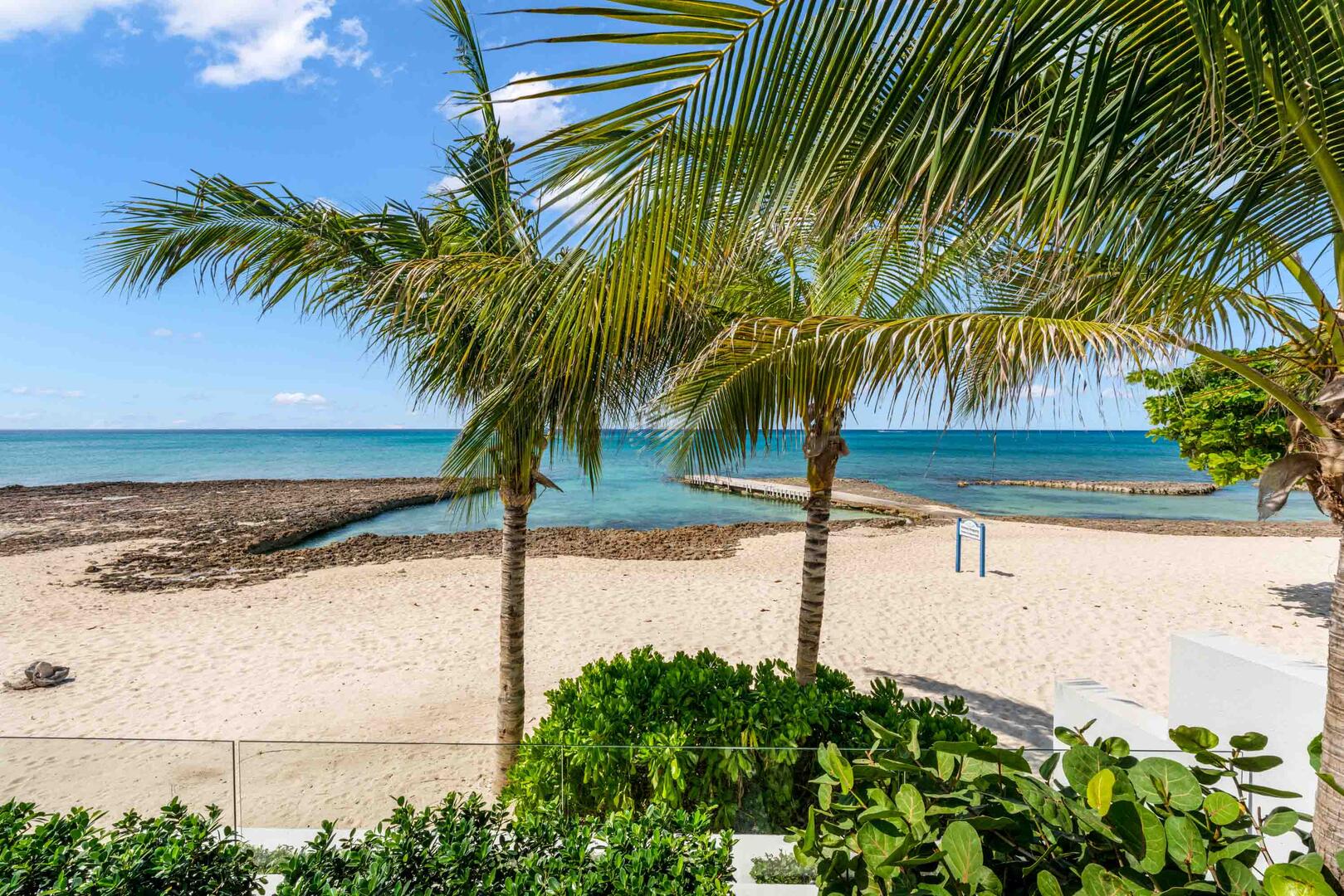 Steps down from the pool deck puts you on Seven Mile Beach.