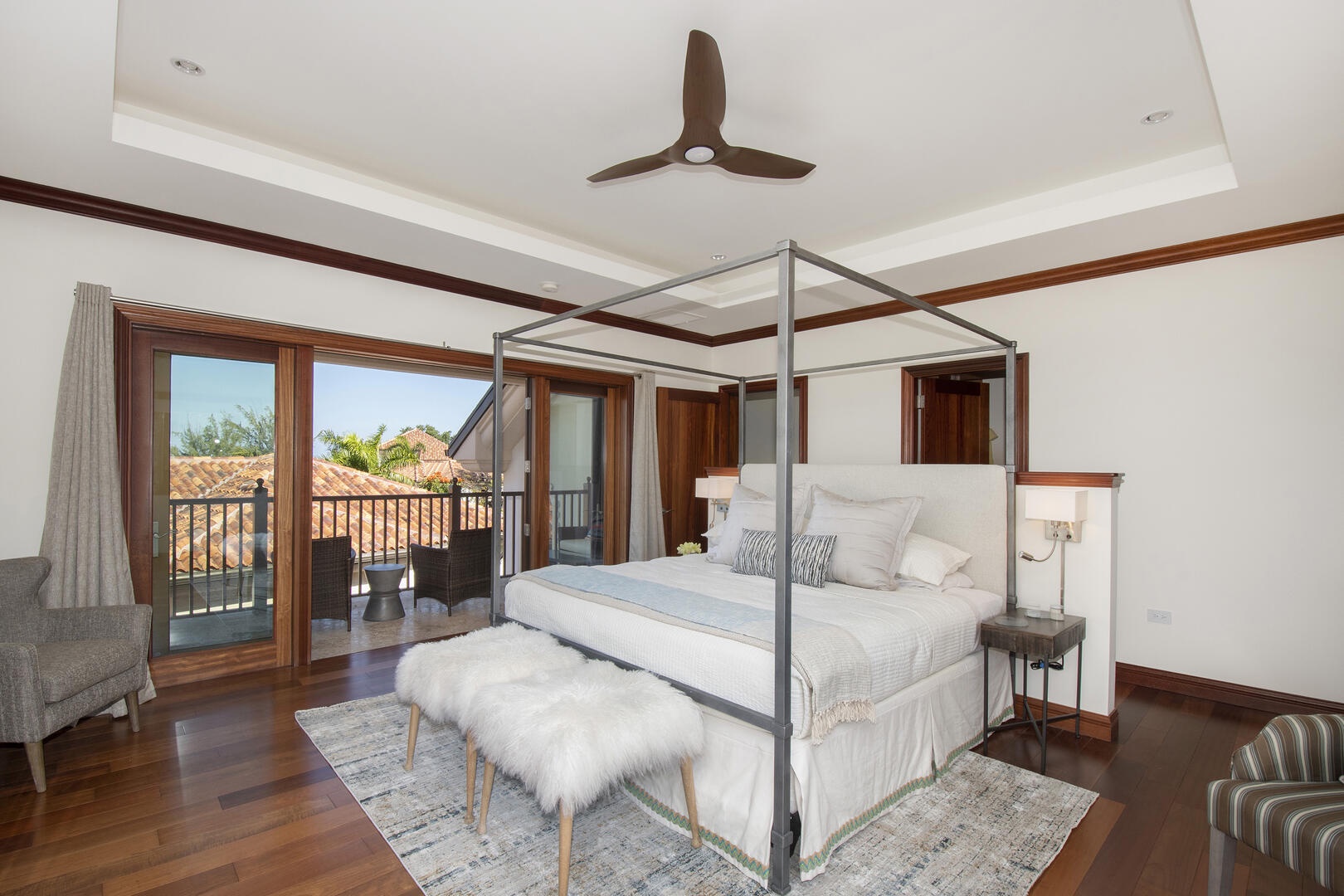 Master suite comes furnished with a king bed.