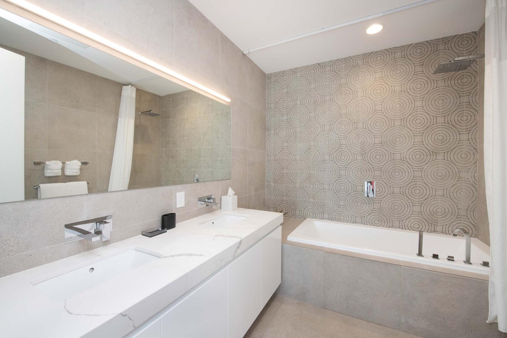 Primary Ensuite #2 with dual vanity and shower bath.