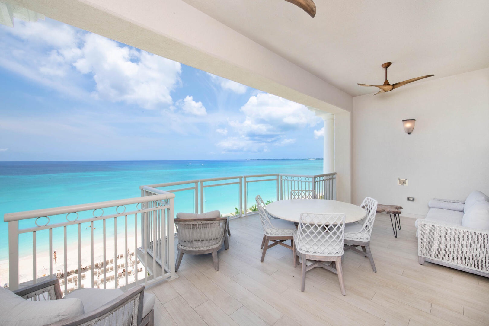 Furnished private balcony with elevated views of Seven Mile Beach.