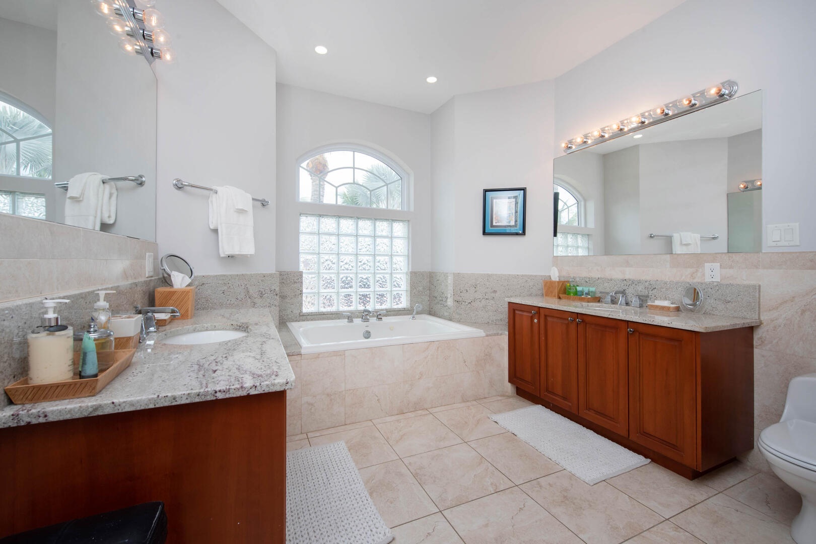 Primary Ensuite bathroom with two sinks and soaking tub.