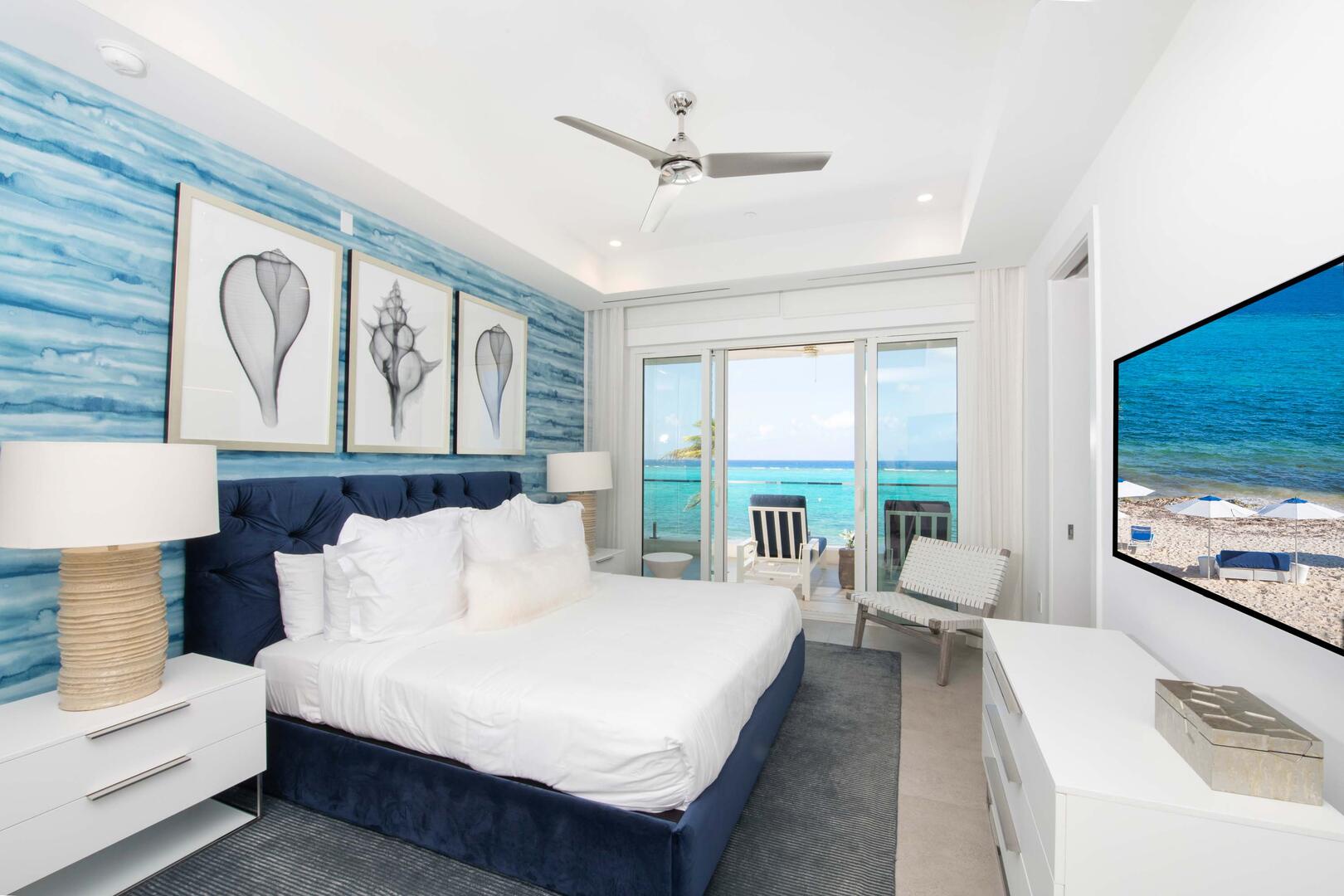 Primary Suite #1 with king bed, SmartTV, and walk-out access to the furnished balcony.