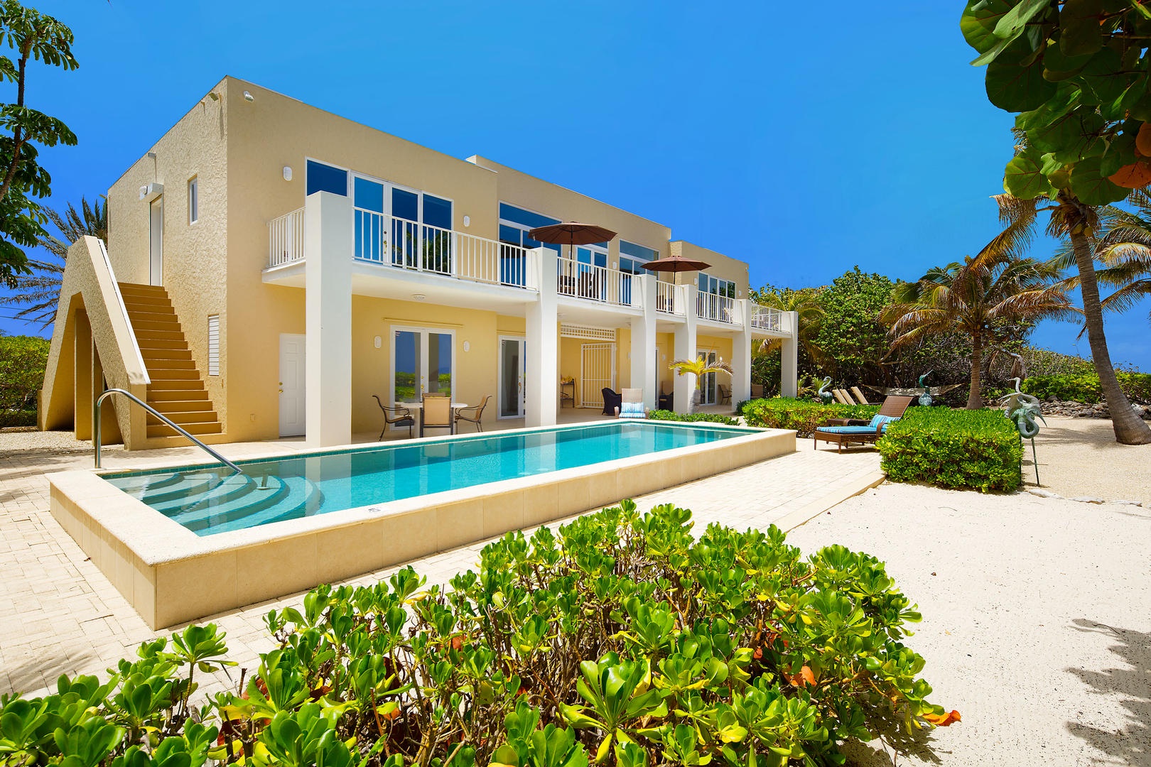 Welcome to Villa Caymanas featuring stunning architectural details and a oceanfront private pool.