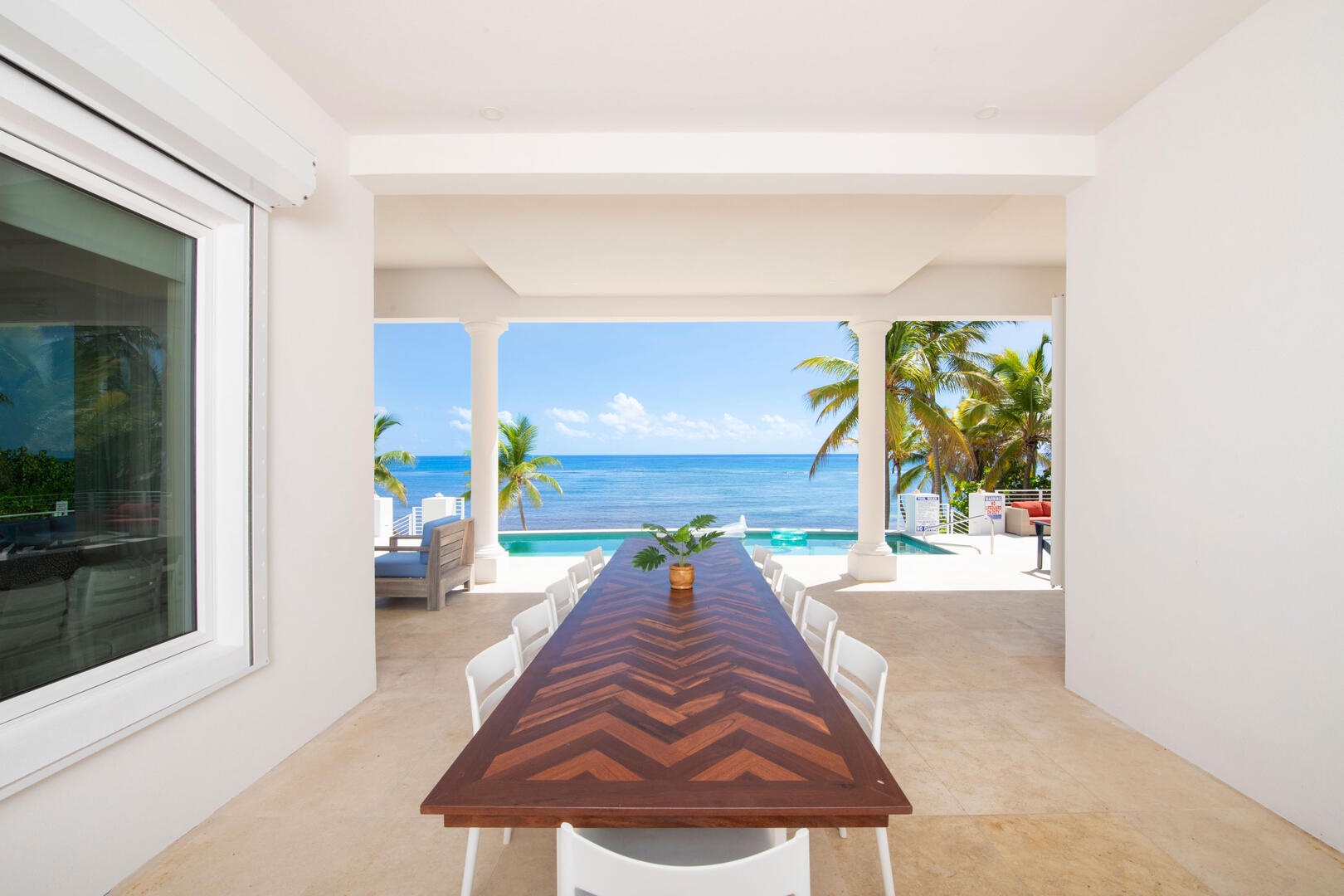Veranda dining table with seaside views.