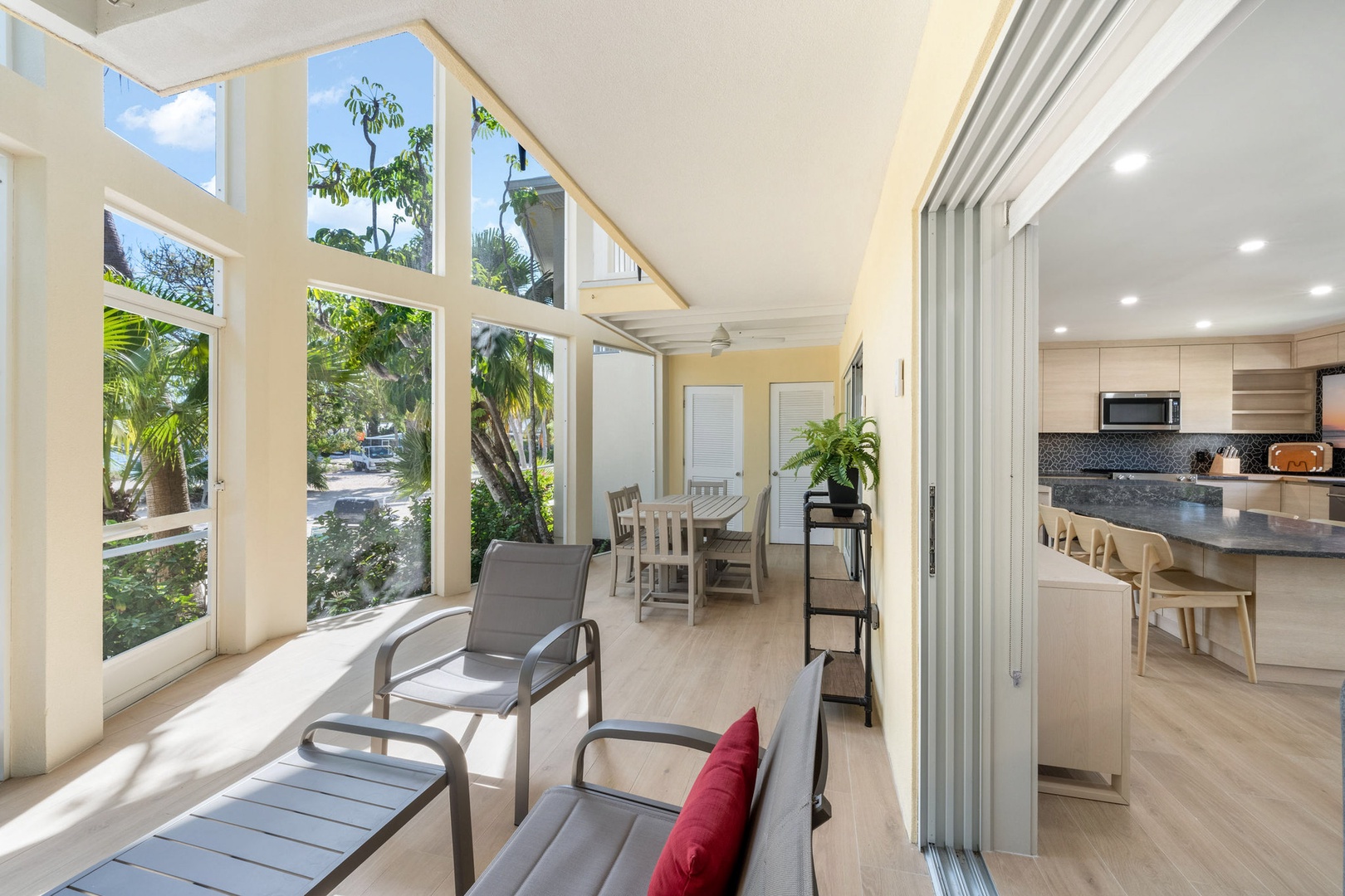 Walkout access from the lower level living areas onto the screened atrium.