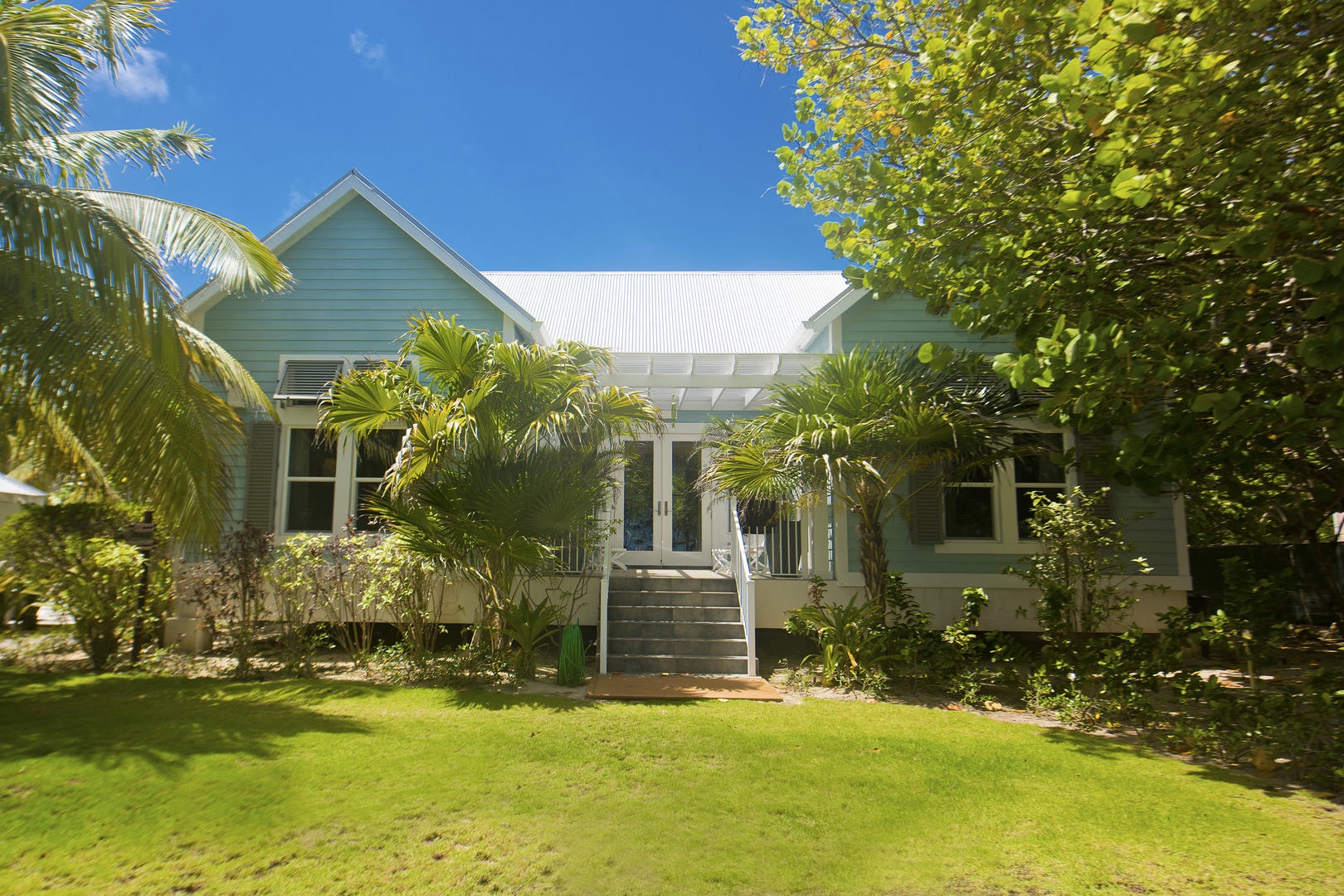 Papaya Cottage's exterior has a bright beach bungalow look to it.