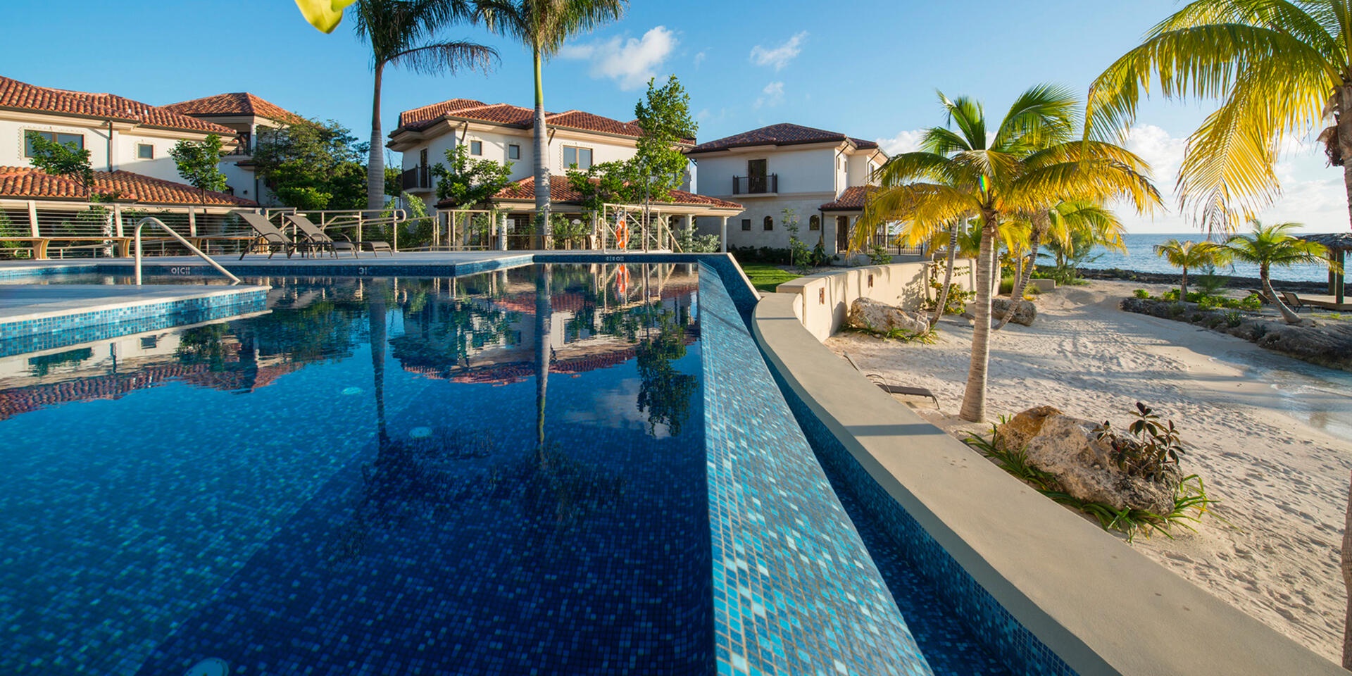 Resort pool overlooking beach.