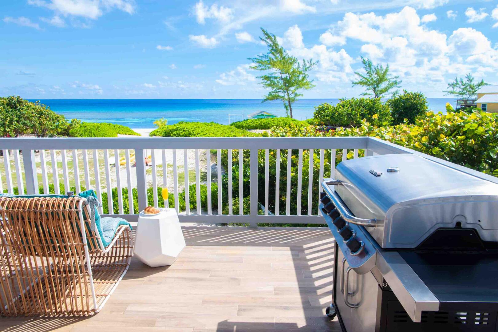 A gas grill sits on the deck for surf and turf cookouts with ocean views. Propane is provided for all stays.