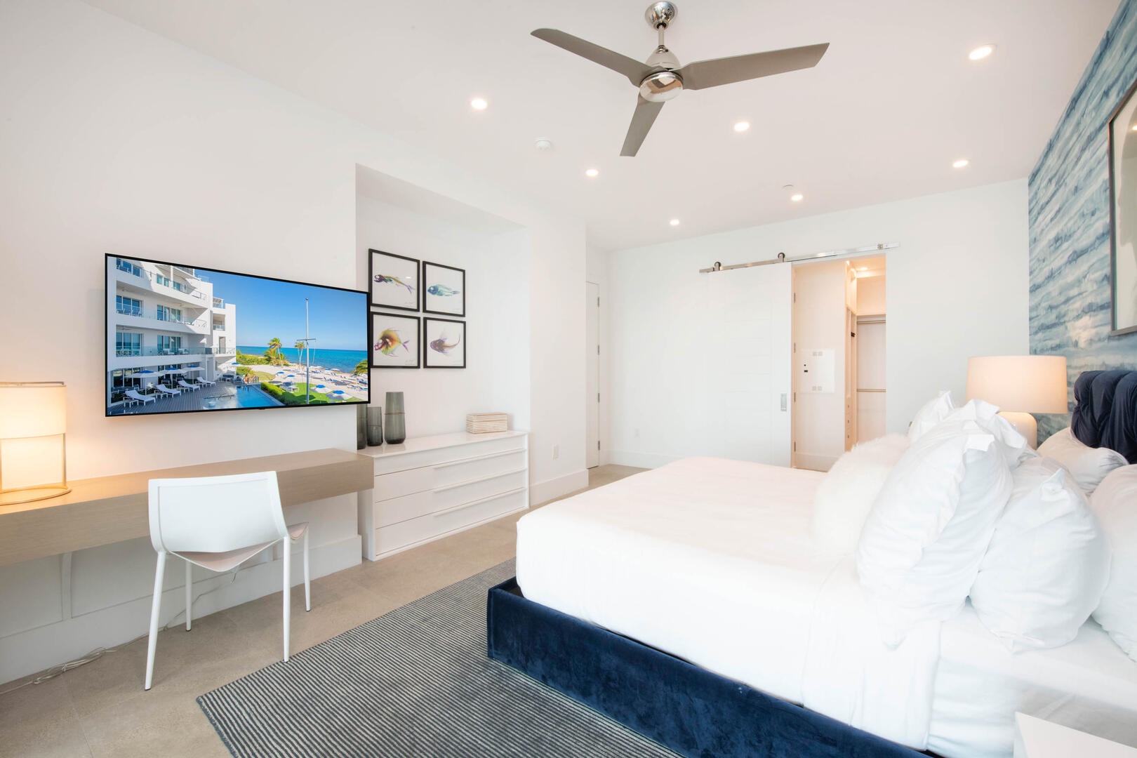 Primary Suite with ocean views, walk-out access to the ocean balcony, SmartTV, and walk-thru closet.