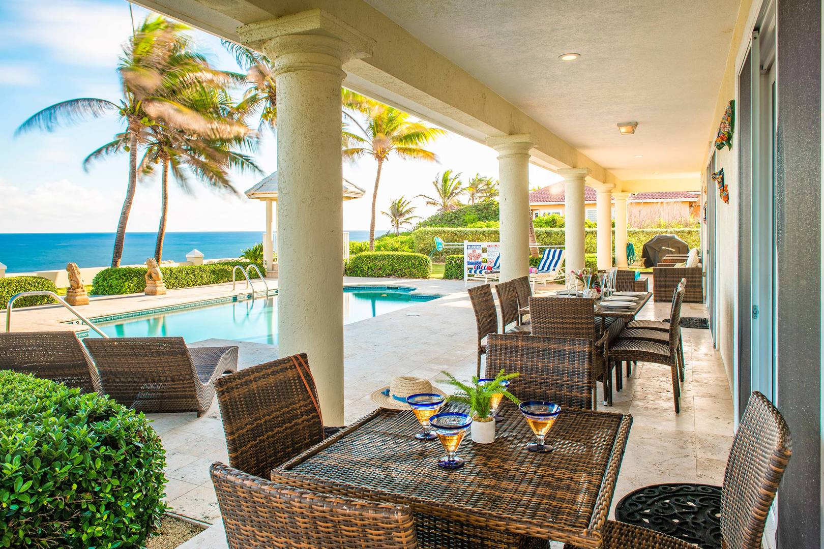 Or dine outdoors under the veranda with sweeping seaside views.