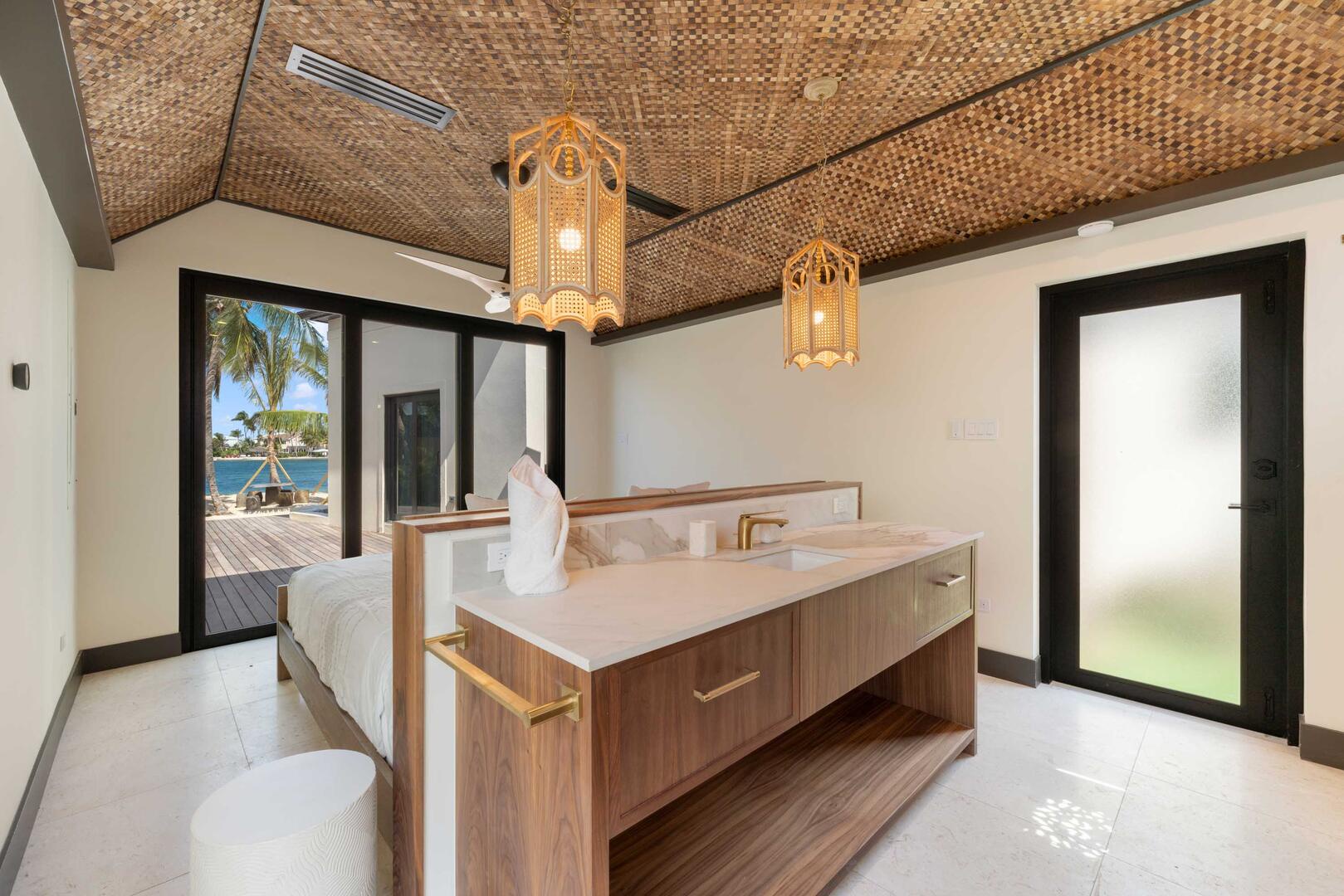 Bedroom 4 with king bed, walkout access to the beach, and in-room ensuite.