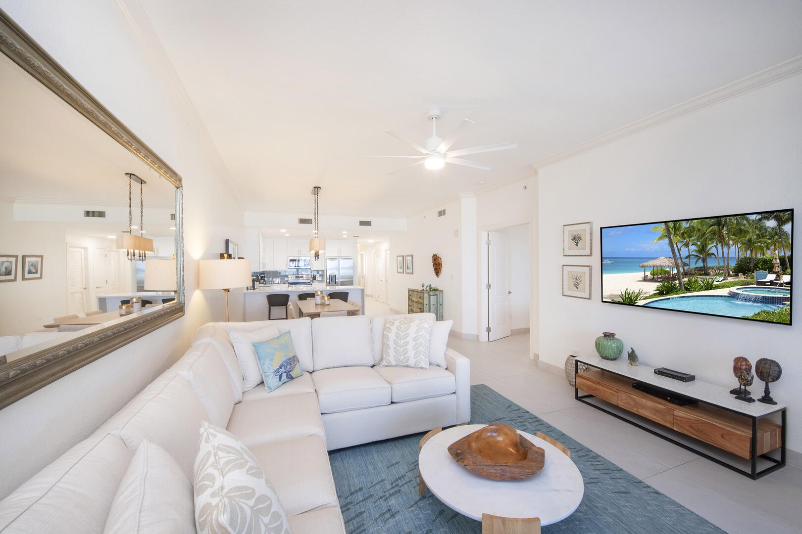 Living area furnished with a new plush sectional sofa and HD cable TV..