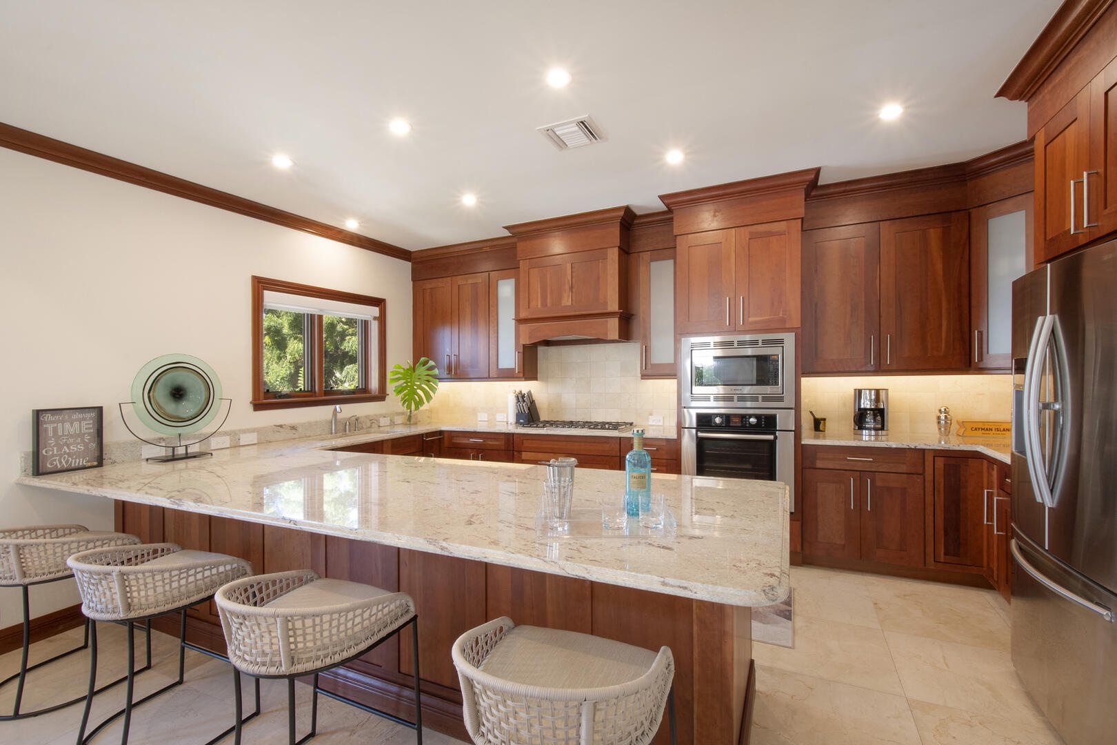 Full kitchen with modern appliances and breakfast bar seating for 4.